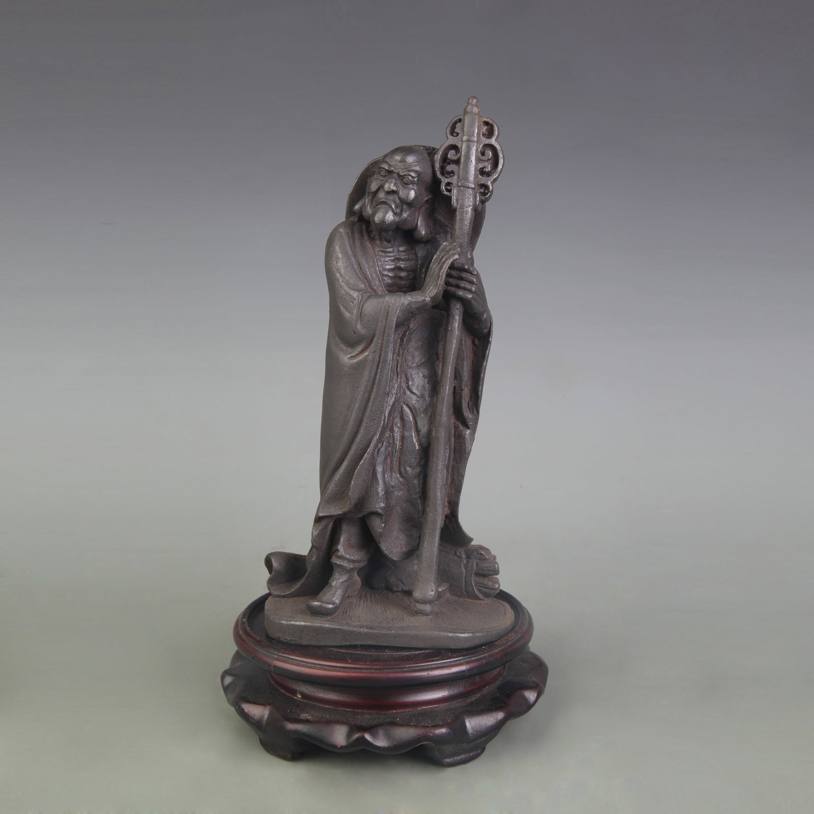 A FINE CAST IRON ARHAT STATUE: Qing Dynasty; Width: 3.9 inch; High: 8.3 inch. Wooden base for picture and display only.