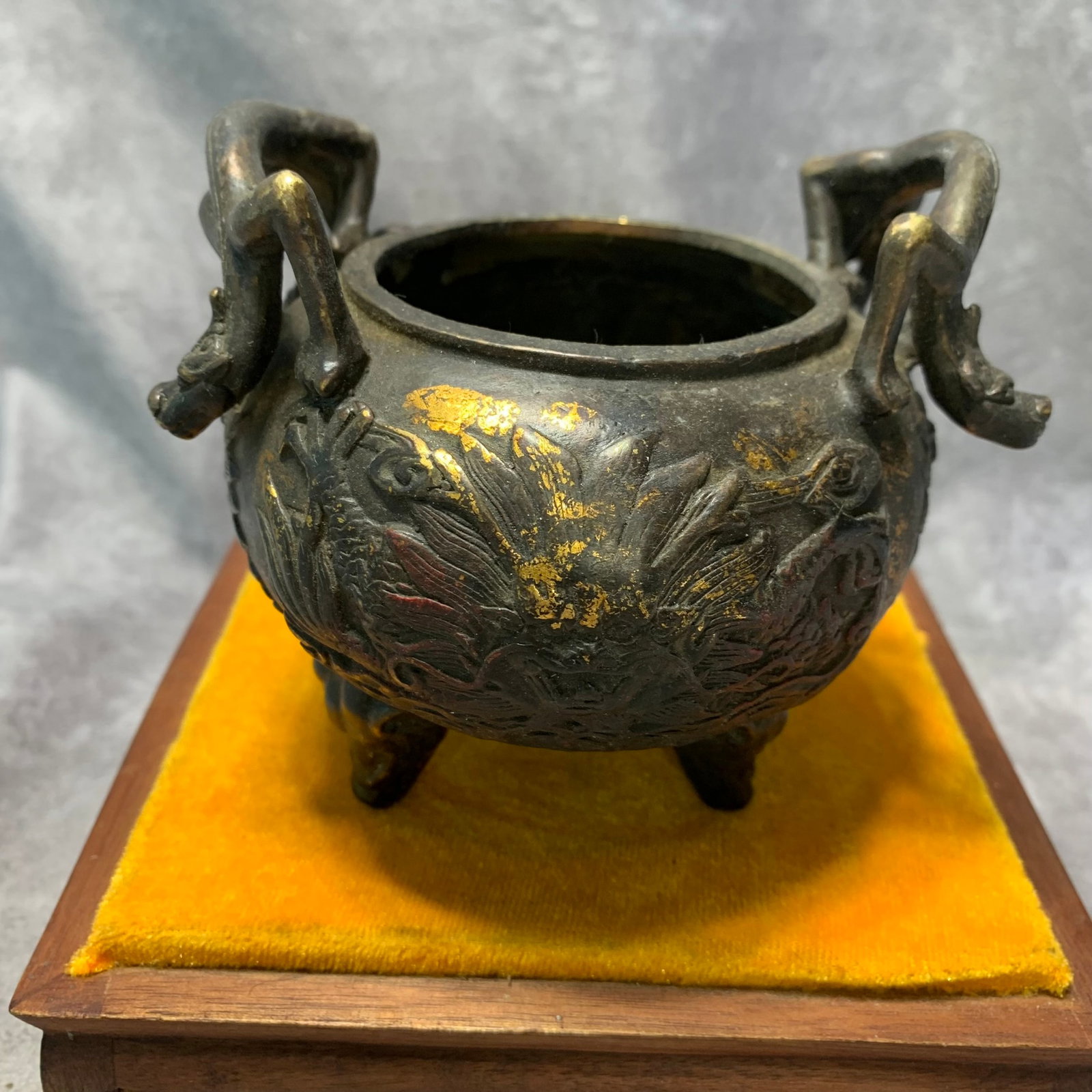 A QIANLONG MARKED BRONZE CENSER WITH ELEPHANT-HEAD FEET AND CHILONG HANDLES: Qing Dynasty; High: 4.3 inch; Diameter: 4.3 inch; Wooden base for picture and display only.