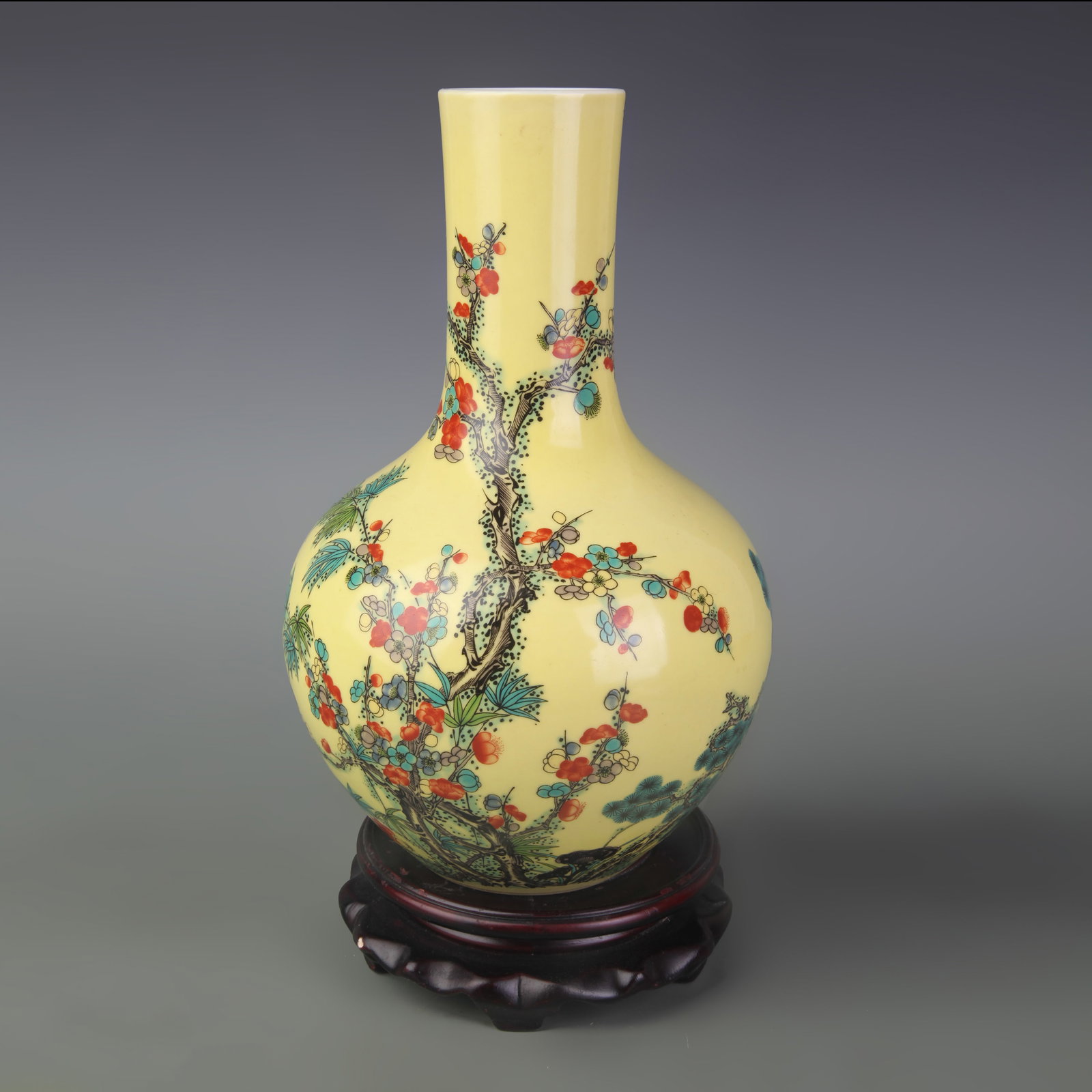 FAMILLE ROSE YELLOW GROUND FLOWER AND BIRD GLOBE VASE: Qing Dynasty Qianlong Period: Diameter: 2.1 inch; High: 9.4 inch; Wooden base for picture and display only.