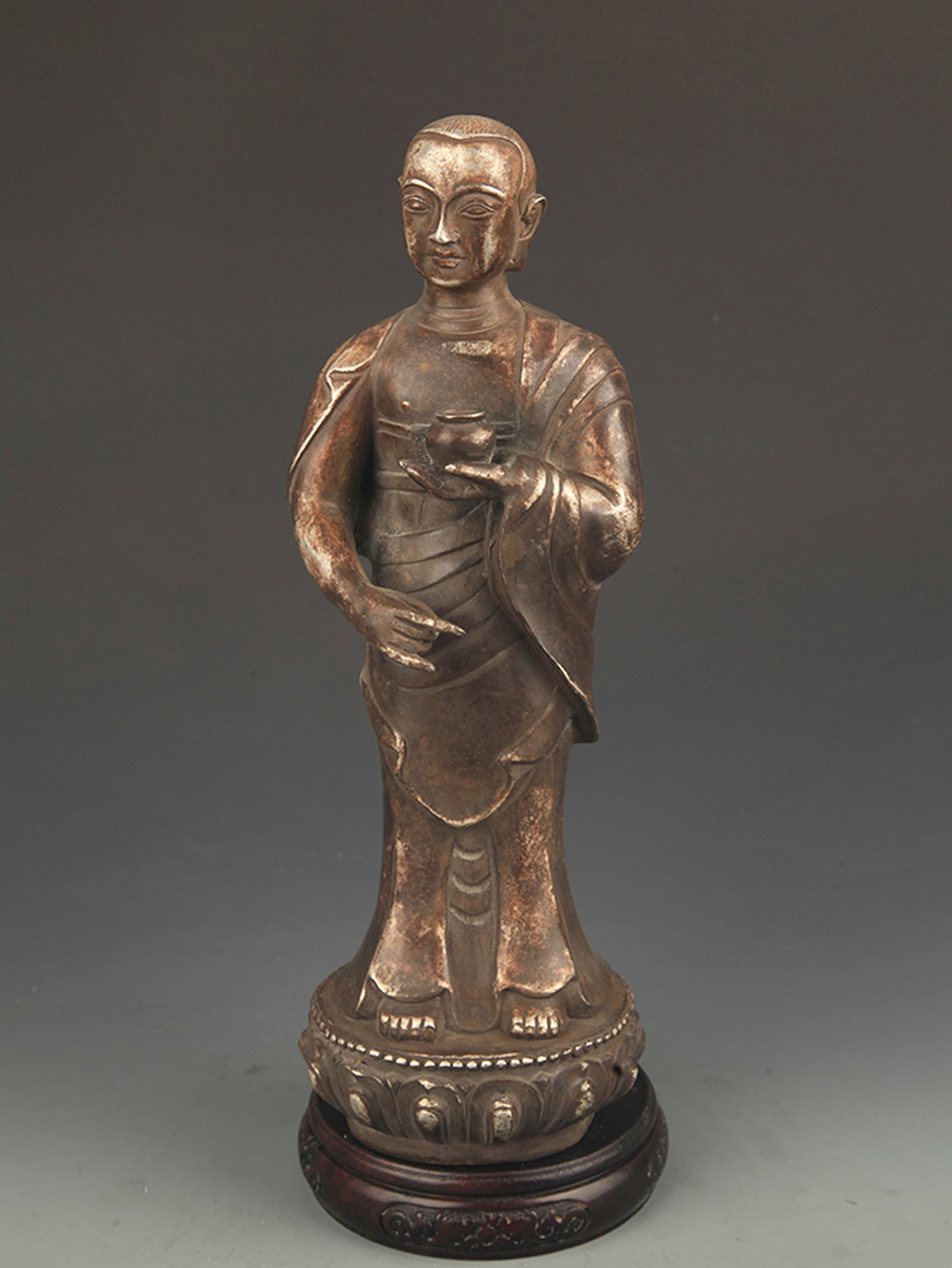 REAR SILVER COVERED VENERABLE RELIC STATUE: 19th Century, High: 12.5 inch; Width: 4.0 inch. Wooden base for picture and display only.