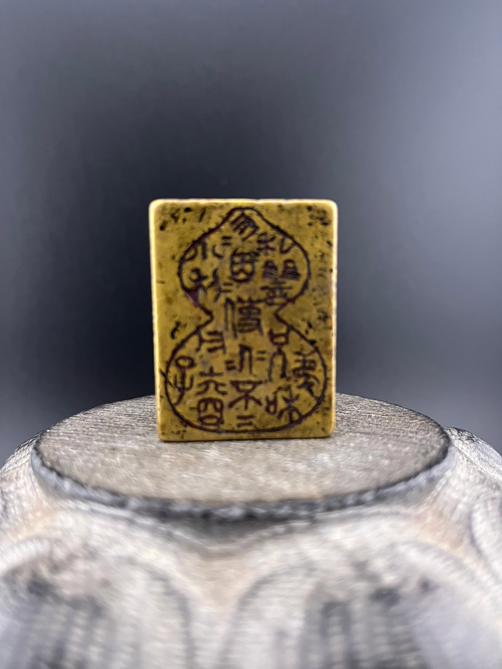 A HEAVY BRONZE MADE TAOIST TALISMANIC PLAQUE MOLD: Modern; Long: 1.5 inch; Width: 1.1 inch; High: 0.5 inch. Wooden base for picture and display only.