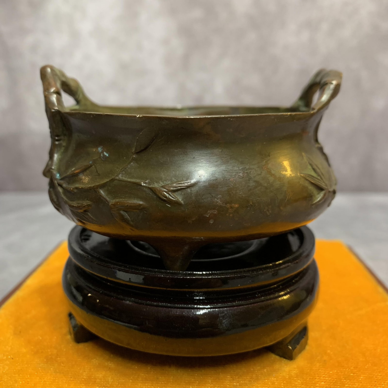 A FINE PLUM TREE PATTERN ROUND BRONZE CENSER: Qing Dynasty; High: 1.6 inch; Diameter: 3.3 inch; Wooden base for picture and display only.