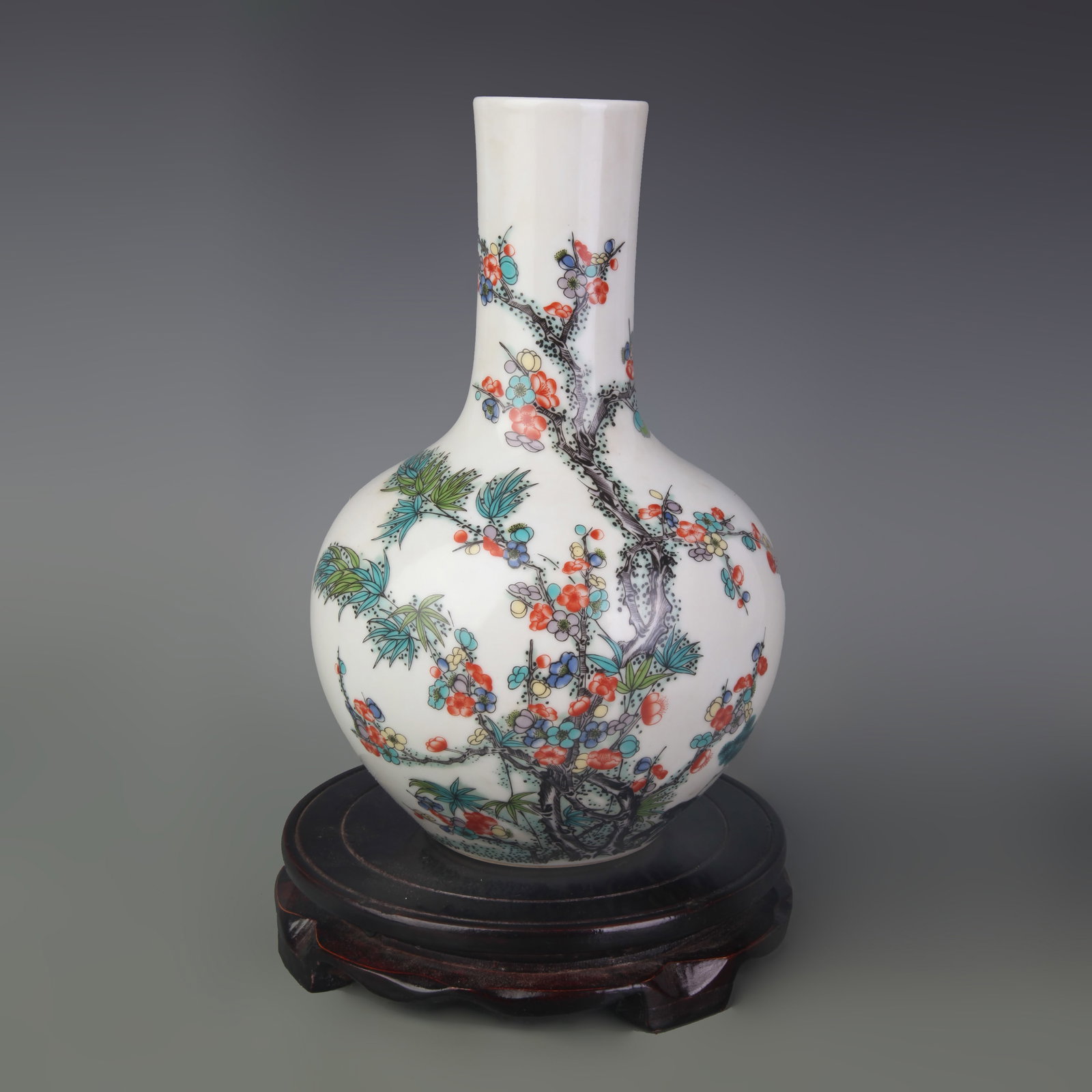 A FAMILLE ROSE PORCELAIN GLOBULAR VASE WITH BIRD-AND-FLOWER MOTIF: Qing Dynasty; High: 9.5 inch; Diameter: 3.1 inch; Wooden base for picture and display only.