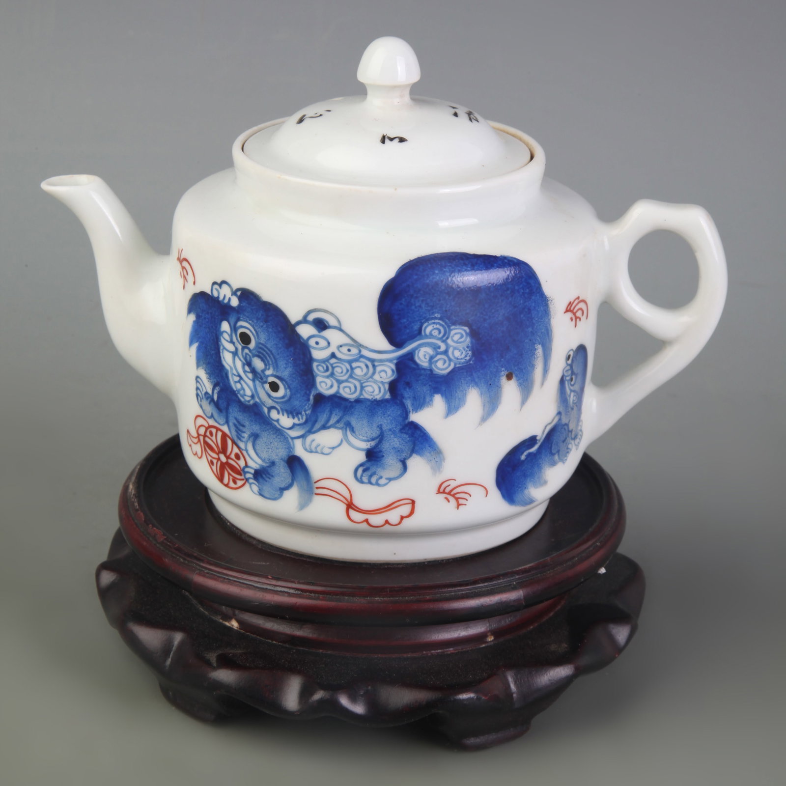 A FAMILLE ROSE PORCELAIN TEAPOT WITH TAISHI SHAOBAO MOTIF: Republic Period; Width: 6.4 inch; High: 4.3 inch; Wooden base for picture and display only.