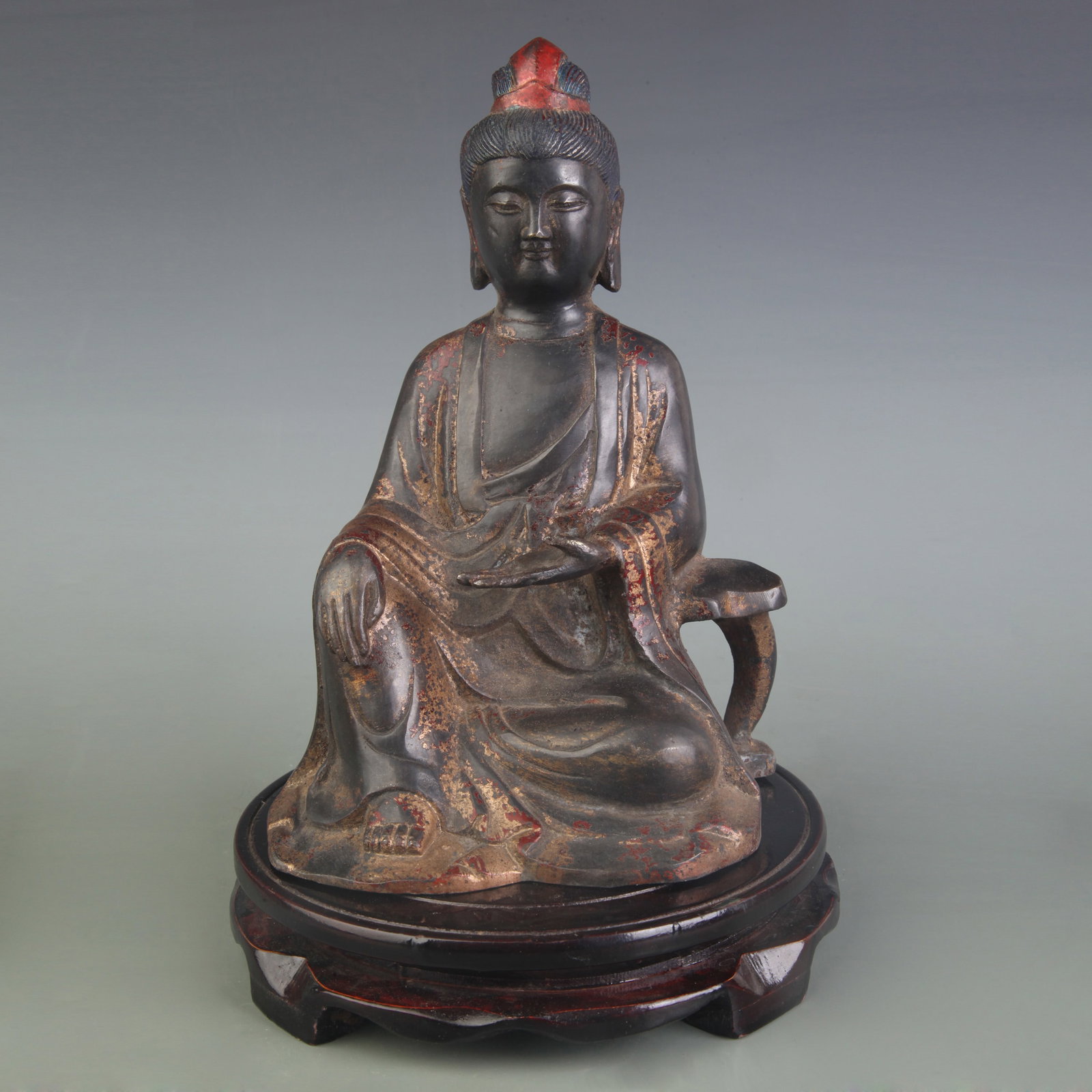 A FINE BRONZE SEATED GUAN YIN: 20th Century; Width: 6.2 inch; High: 8.9 inch; Wooden base for picture and display only.