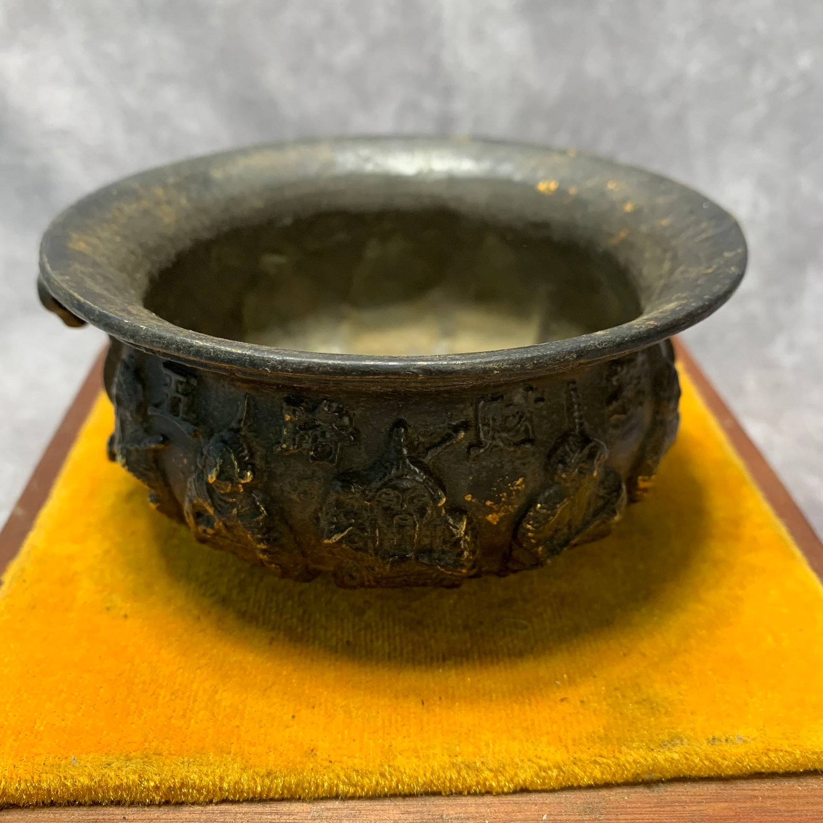 GILT BRONZE INCENSE BURNER WITH FIGURES AND RUYI HANDLES: Ming Dynasty Style; High: 2.1 inch; Diameter: 4.5 inch; Wooden base for picture and display only.