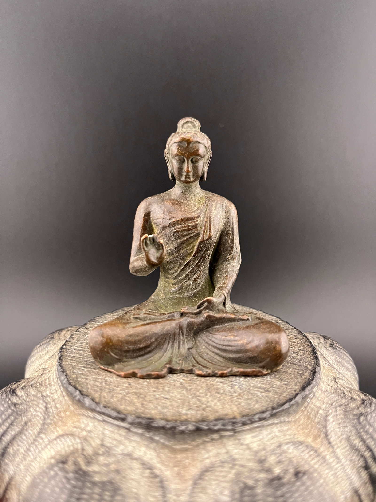 A SMALL BRONZE SHAKYAMUNI BUDDHA STATUE: 19th Century; Long: 2 inch; Width: 1.6 inch; High: 2.5 inch. Wooden base for picture and display only.
