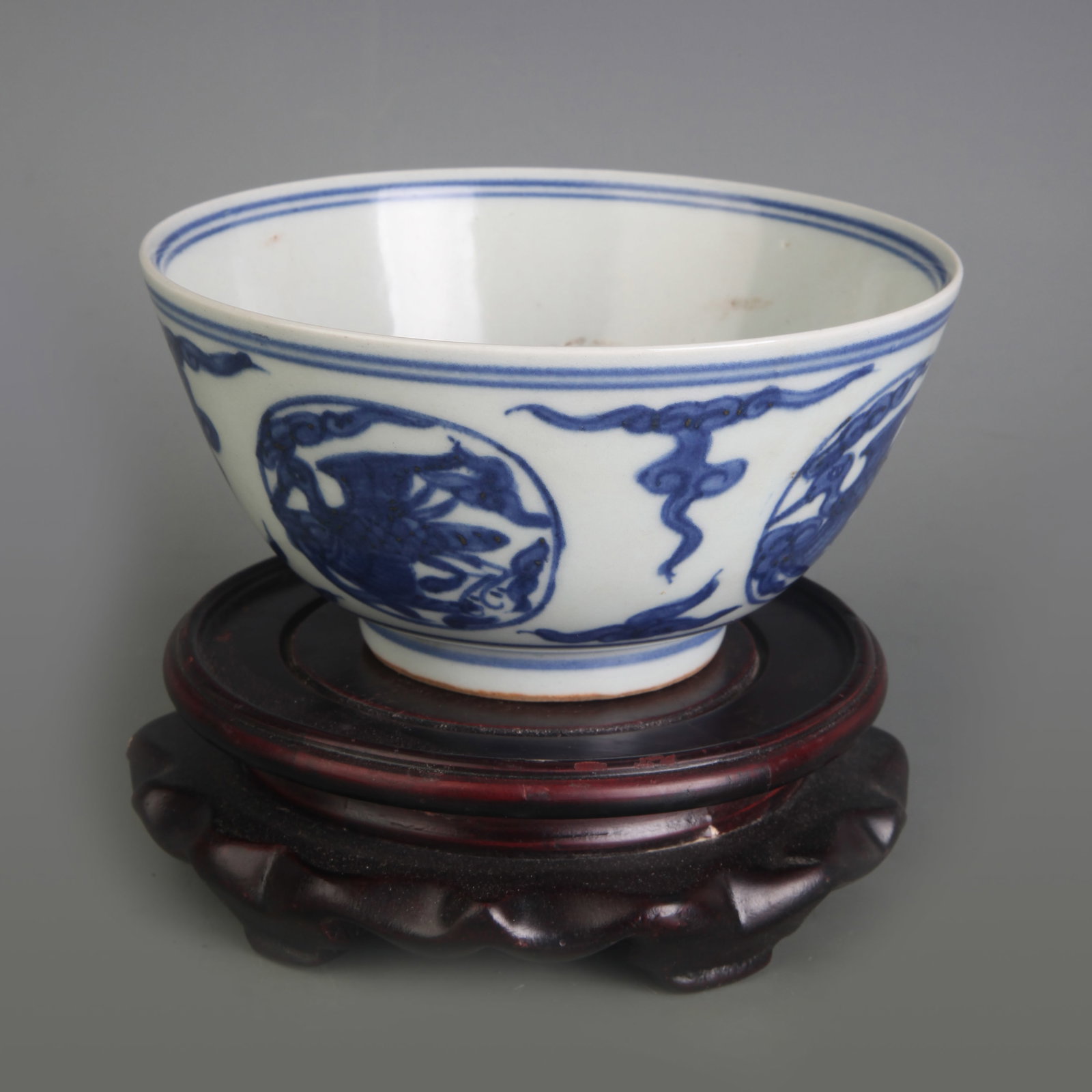 BLUE AND WHITE BOWL WITH FRAMED PHOENIX MOTIF: Ming Dynasty; Diameter: 5.2 inch; High:2.6 inch; Wooden base for picture and display only.