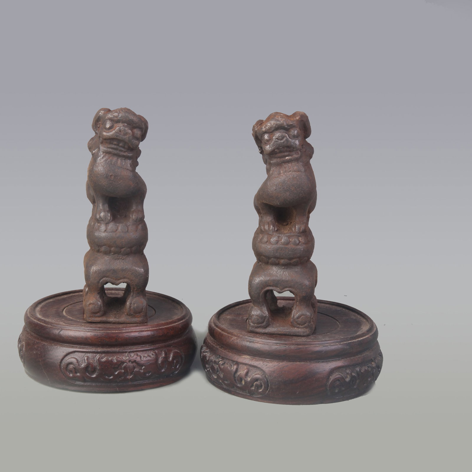 PAIR OF SMALL CAST IRON LION FIGURINES: Ming Dynasty Style; High: 3.7 inch; Wooden base for picture and display only.