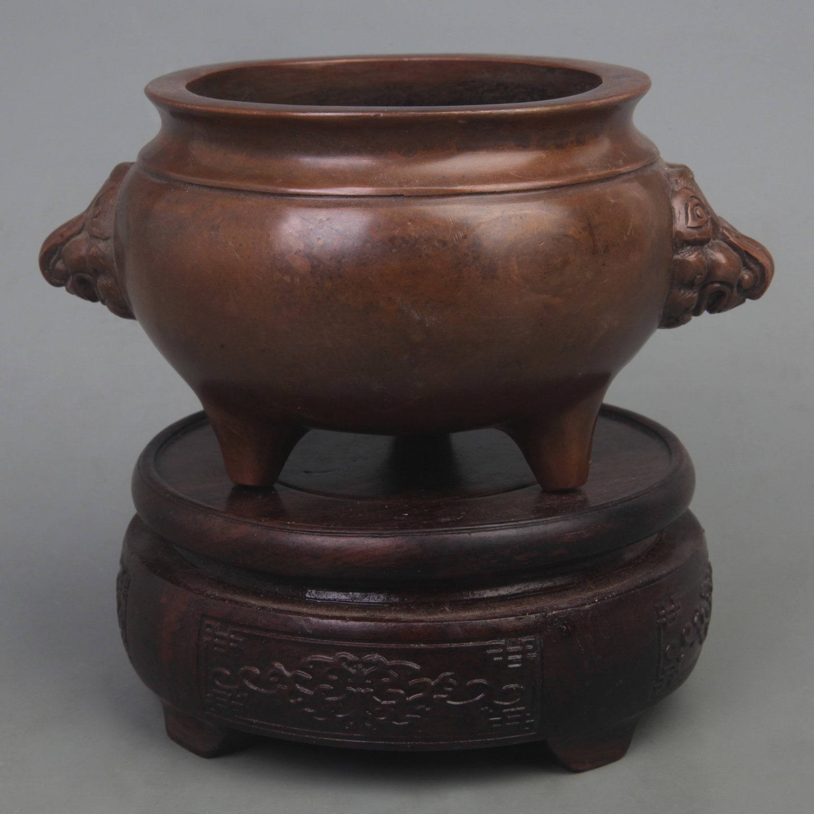 A XUAN DE STYLE THREE FOOT BRONZE CENSER: Ming Dynasty Style; Diameter: 5.6 inch; High: 3.0 inch. Wooden base for picture and display only.