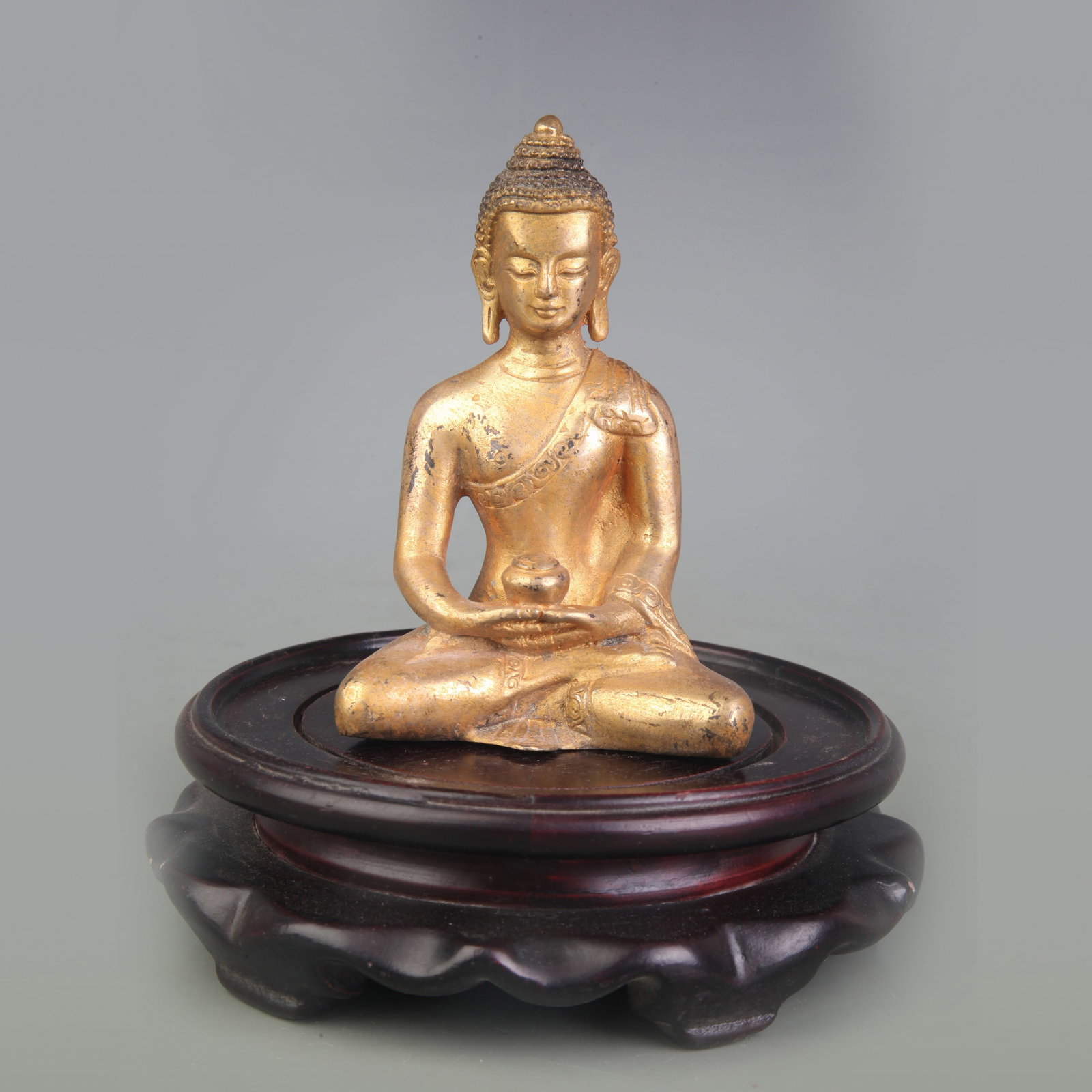 A SMALL BRONZE FIGURE OF AMITABHA BUDDHA (1 of 5)