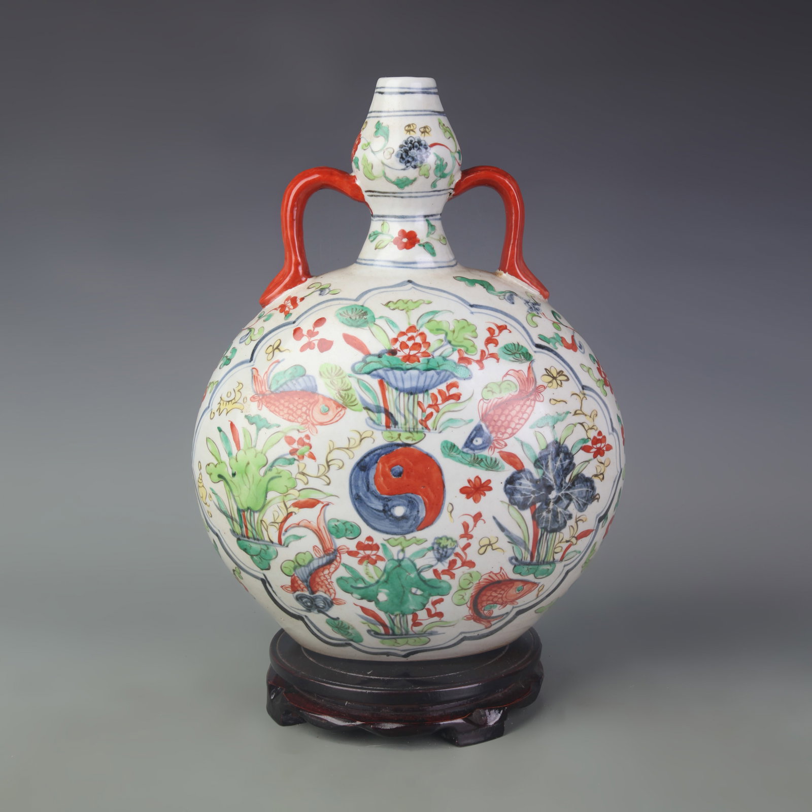 A PORCELAIN WUCAI MOON FLASK WITH FISH-AND-ALGAE MOTIF: Ming Dynasty Style; Width: 10.0 inch; High: 13.5 inch; Wooden base for picture and display only.