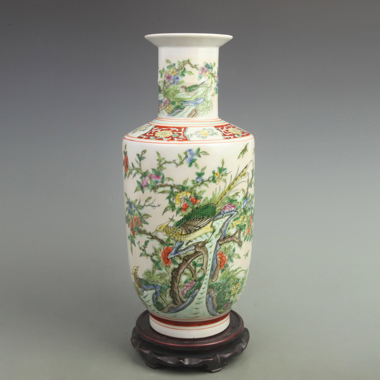 FAMILLE ROSE FLORAL AND BIRD PATTERN CLUB SHAPED PORCELAIN VASE: Qing Dynasty; High: 16.81 inch; Width: 7.5 inch. Wooden base for picture and display only.