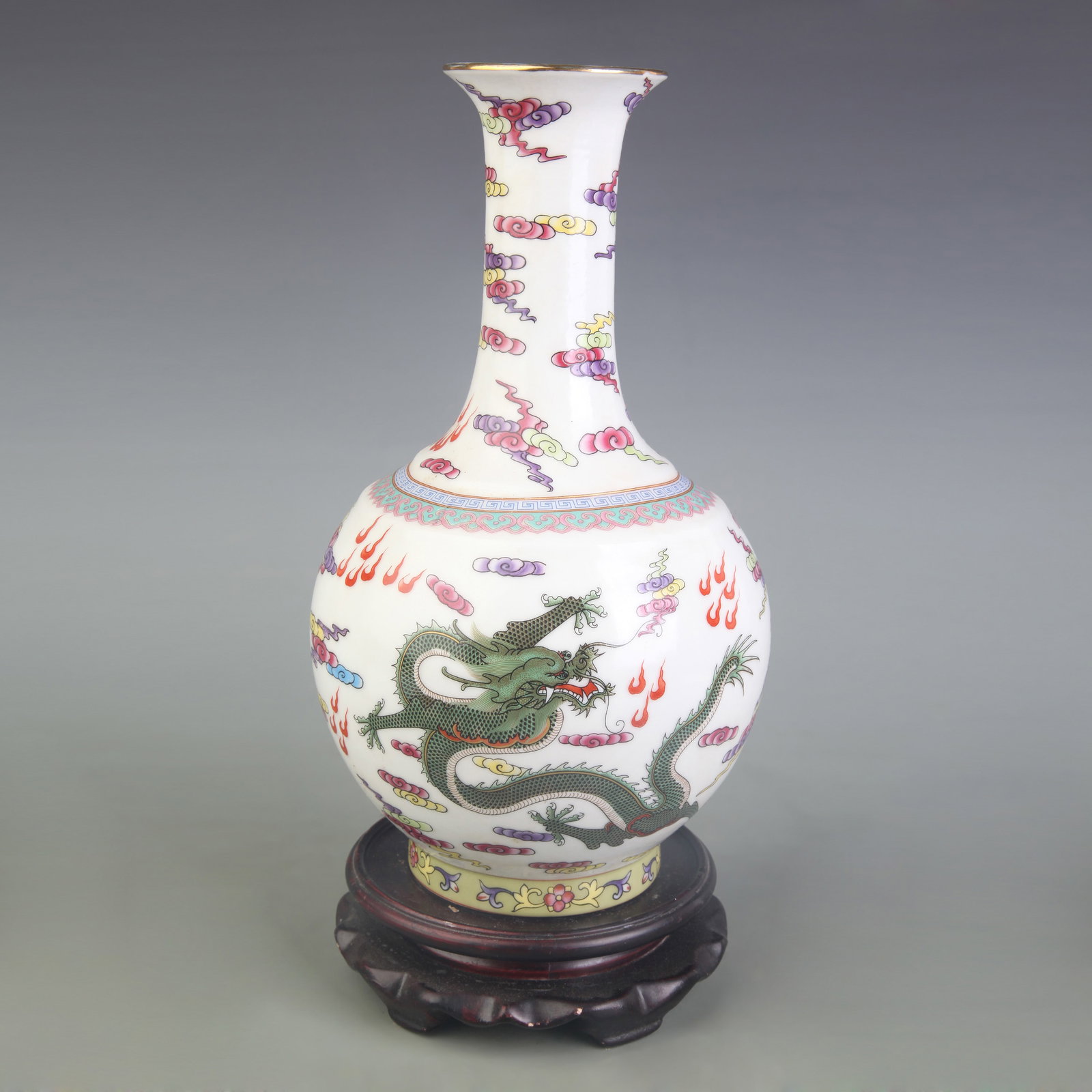 A FAMILLE ROSE PORCELAIN VASE WITH DRAGON MOTIF: Qing Dynasty Qian Long Period; Diameter: 3.5 inch; High: 10.4 inch; Wooden base for picture and display only.