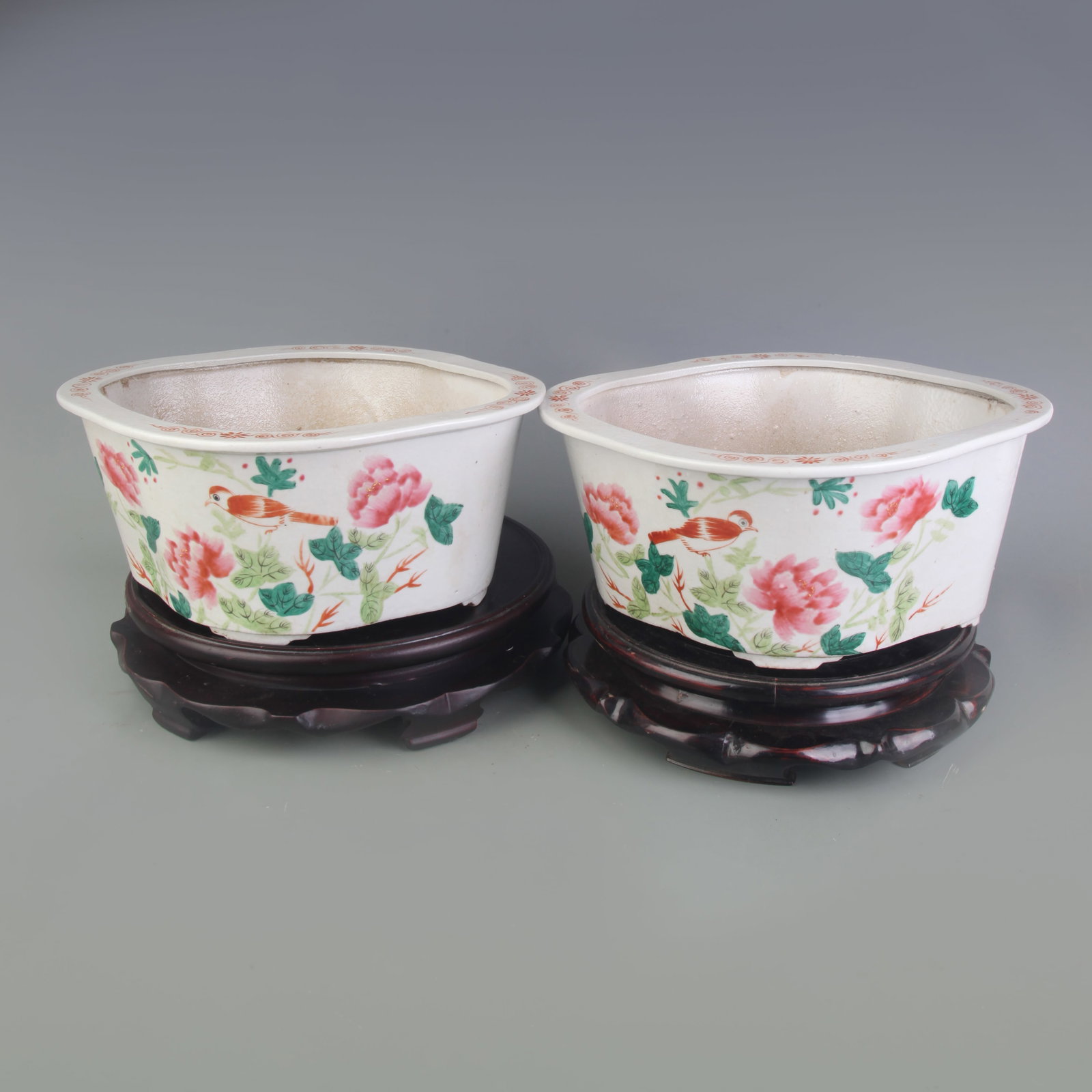 PAIR OF FAMILLE ROSE FLOWER AND BIRD PATTERN FLOWER POTS: Republic Period; Long: 11.3 inch; High:5.0 inch; Wooden base for picture and display only.