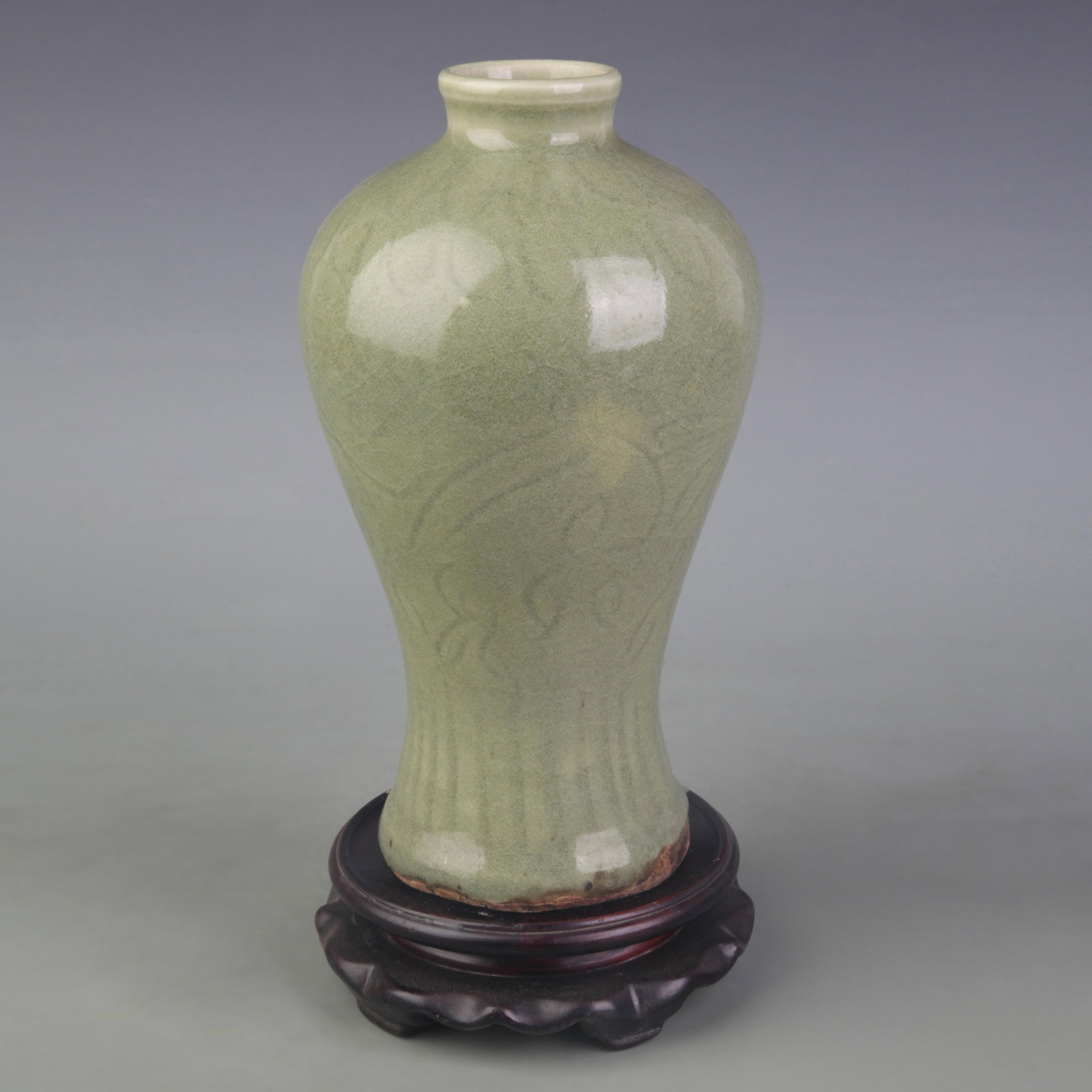 A LONGQUAN KILN MEIPING VASE WITH INCISED FLORAL DECORATION: Yuan Dynasty Style; High: 9.0 inch; Wooden base for picture and display only.