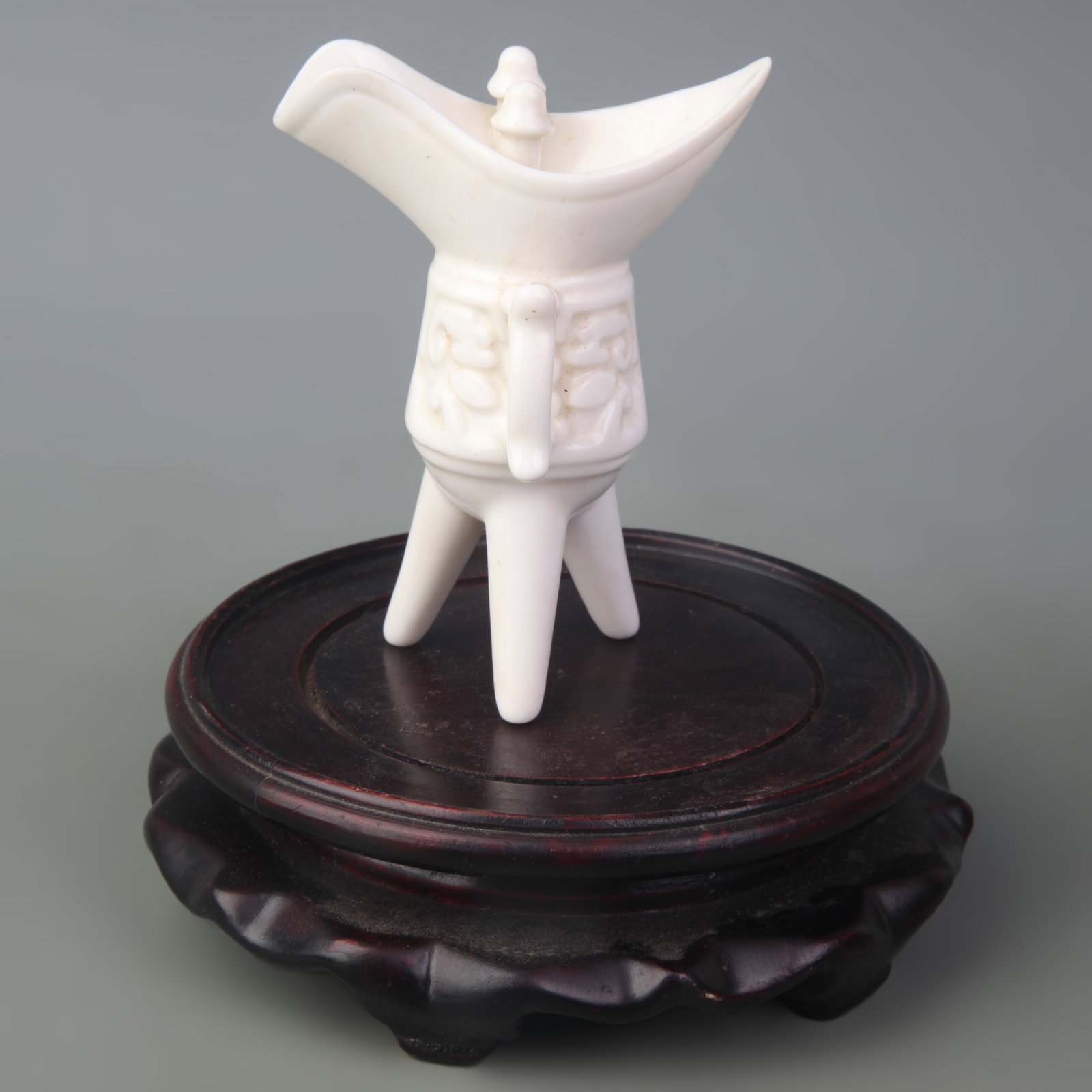 DEHUA WHITE PORCELAIN BLANC-DE-CHINE JUE WINE CUP: Qing Dynasty; High: 3.8 inch; Wooden base for picture and display only.