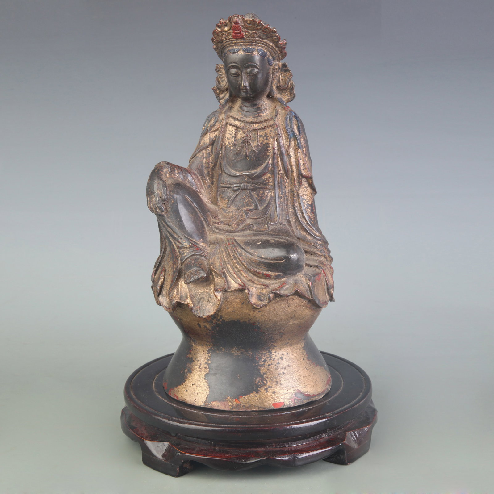 A BRONZE FIGURE OF SEATED GUANYIN: 20th Century; Width: 4.6 inch; High: 10.0 inch; Wooden base for picture and display only.