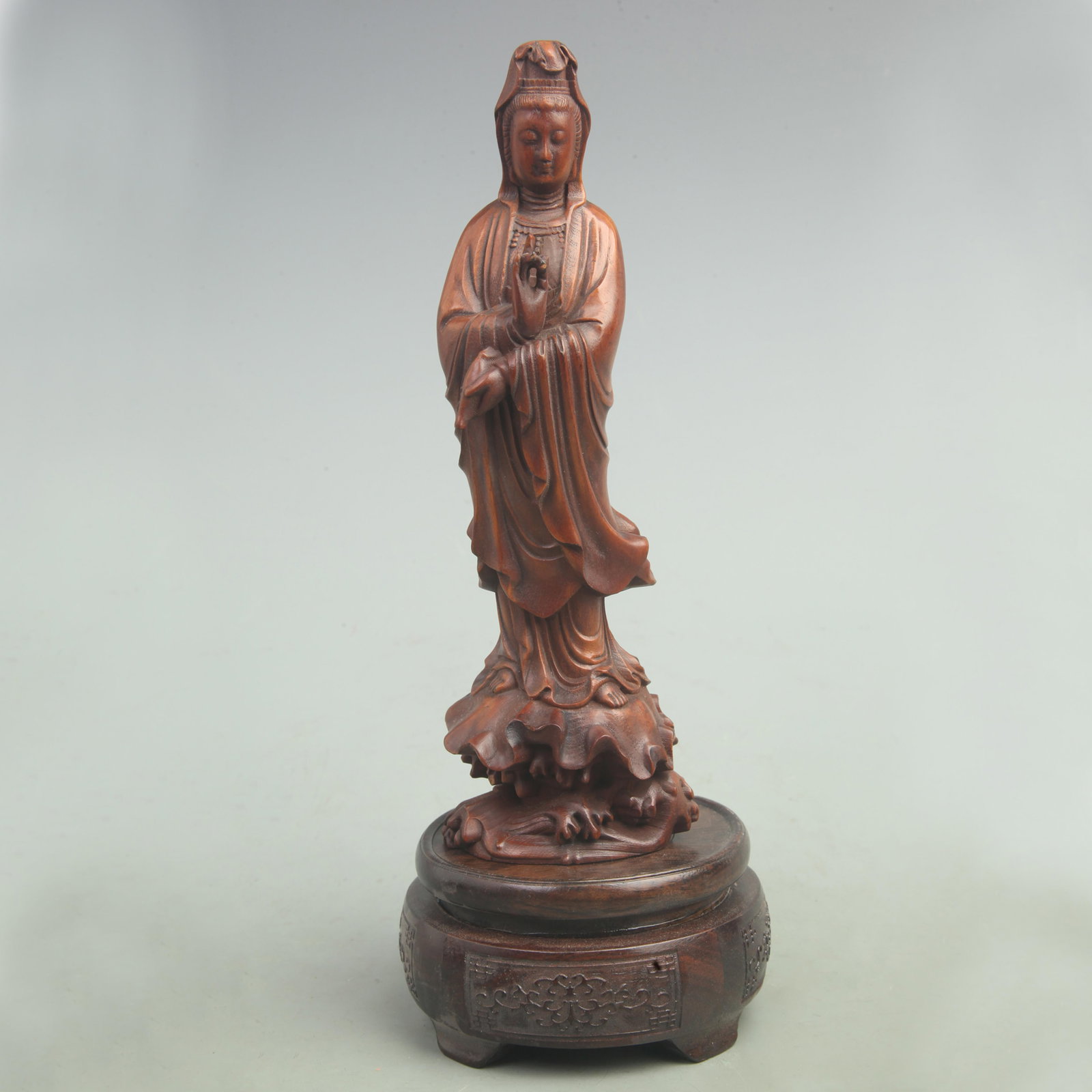 A FINE BOXWOOD IN FIGURE OF GUAN YIN BUDDHA: Qing Dynasty; High: 8 inch; Width: 2.6 inch. Wooden base for picture and display only.