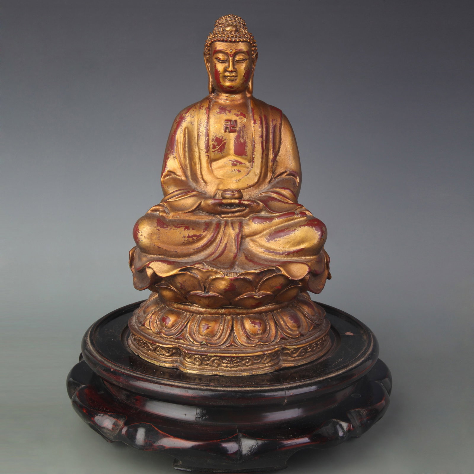 TIBETAN BUDDHIST GILDED BRONZE VAISRAVANA STATUE: Qing Dynasty; Long: 6.6 inch; Width: 4.8 inch; High: 7.4 inch. Wooden base for picture and display only.
