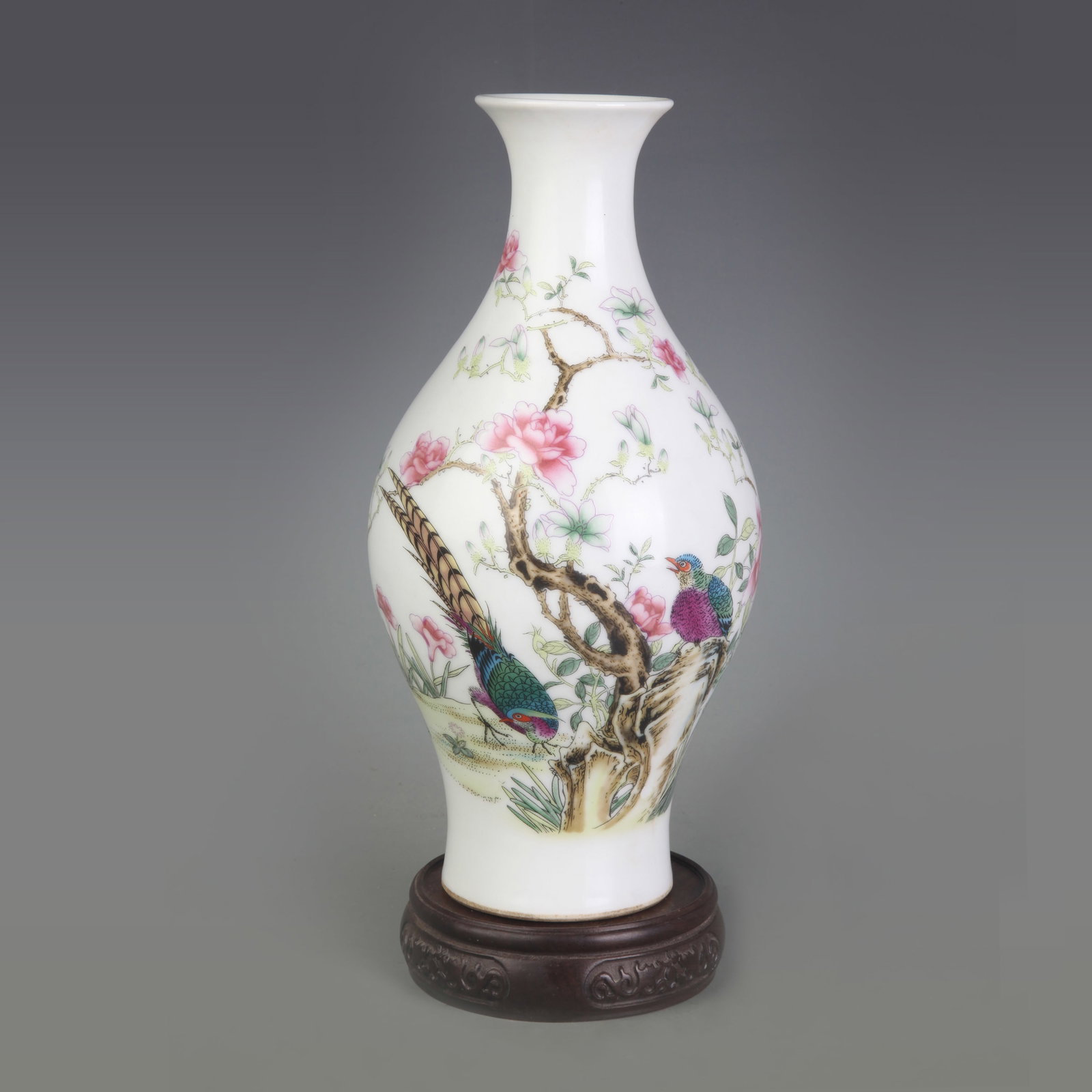 A FAMILLE-ROSE FLORAL AND BIRD VASE: Qing Dynasty Qian Long Period; Diameter: 2.7 inch; High: 9.2 inch; Wooden base for picture and display only.