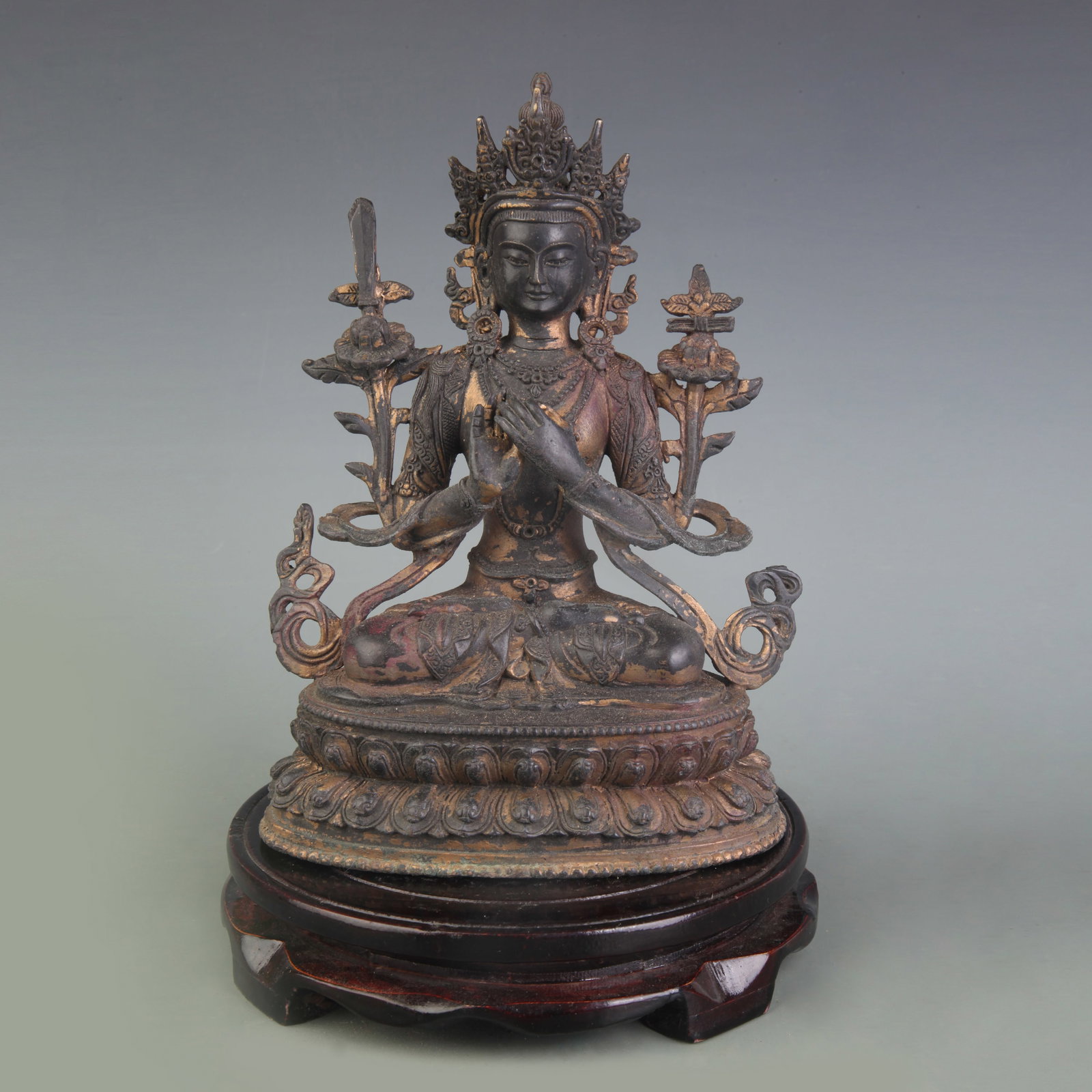 A FINE BRONZE FIGURE OF MANJUSHRI BODHISATTVA: Qing Dynasty; High: 8.5 inch; Wooden base for picture and display only.