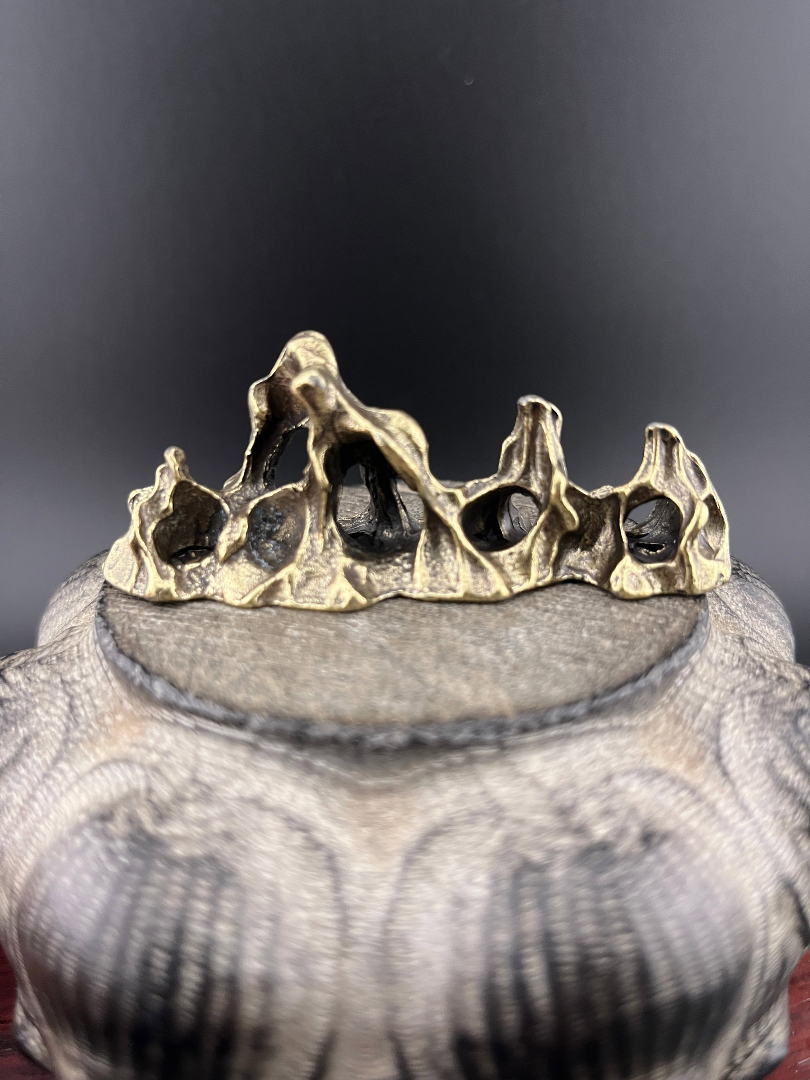 A SMALL BRONZE MOUNTAIN FIGURE (1 of 5)