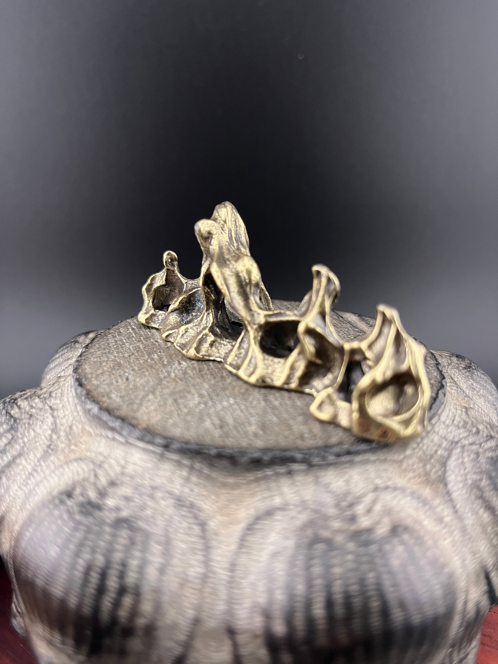 A SMALL BRONZE MOUNTAIN FIGURE - 3