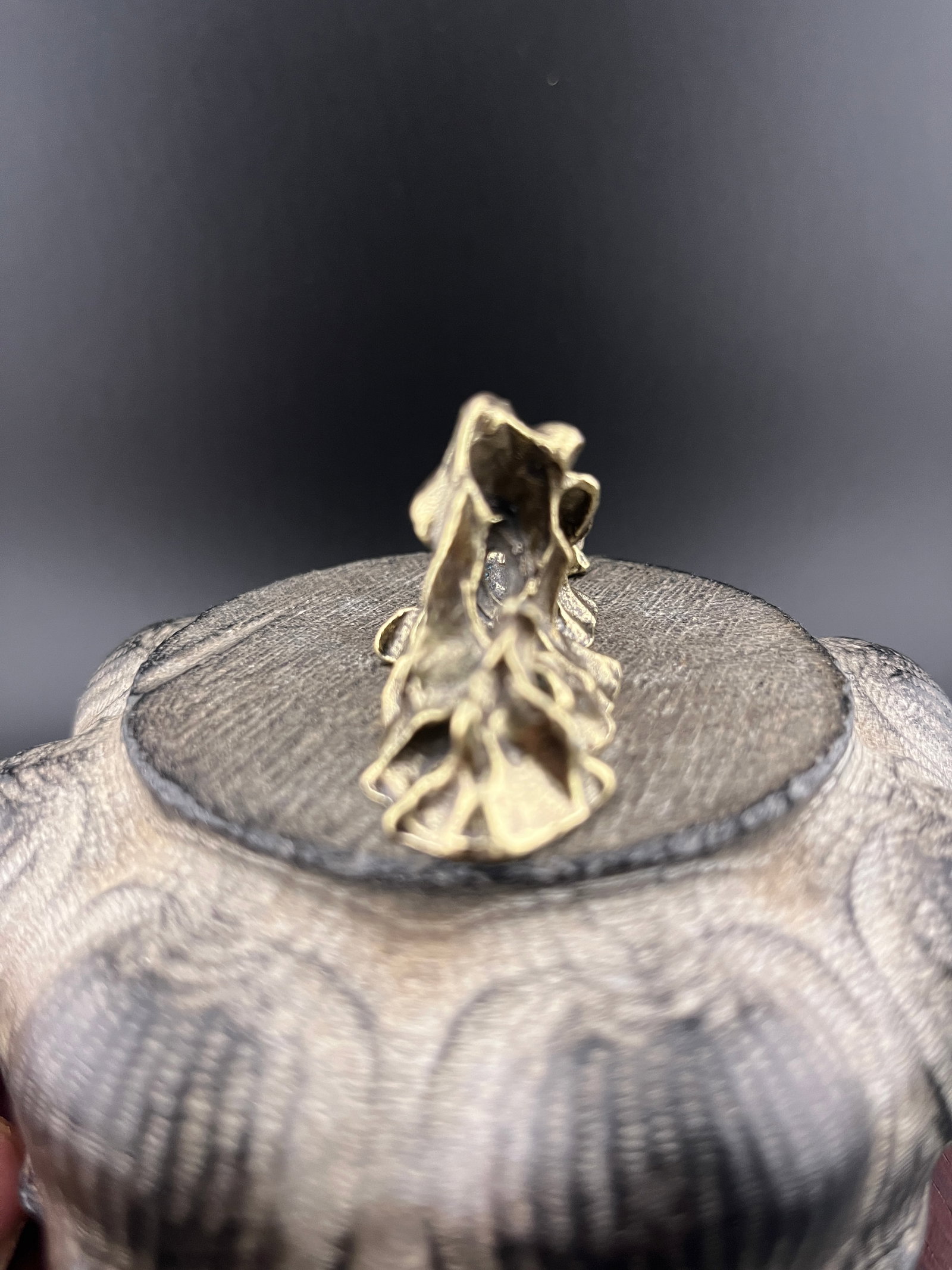 A SMALL BRONZE MOUNTAIN FIGURE - 4