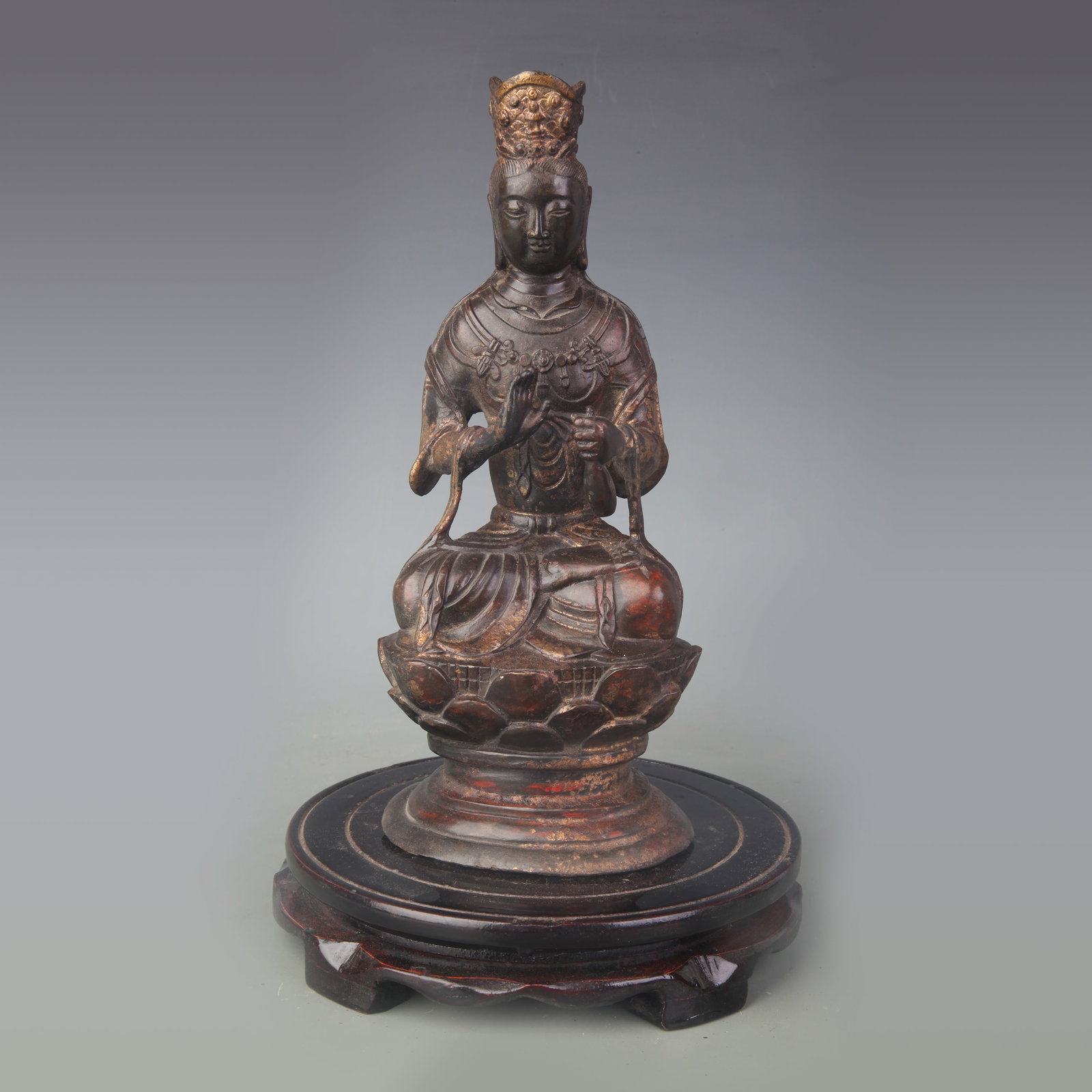 SEATED BRONZE GUANYIN STATUE (AVALOKITESHVARA): 19th Century; High: 9.5 inch; Wooden base for picture and display only.