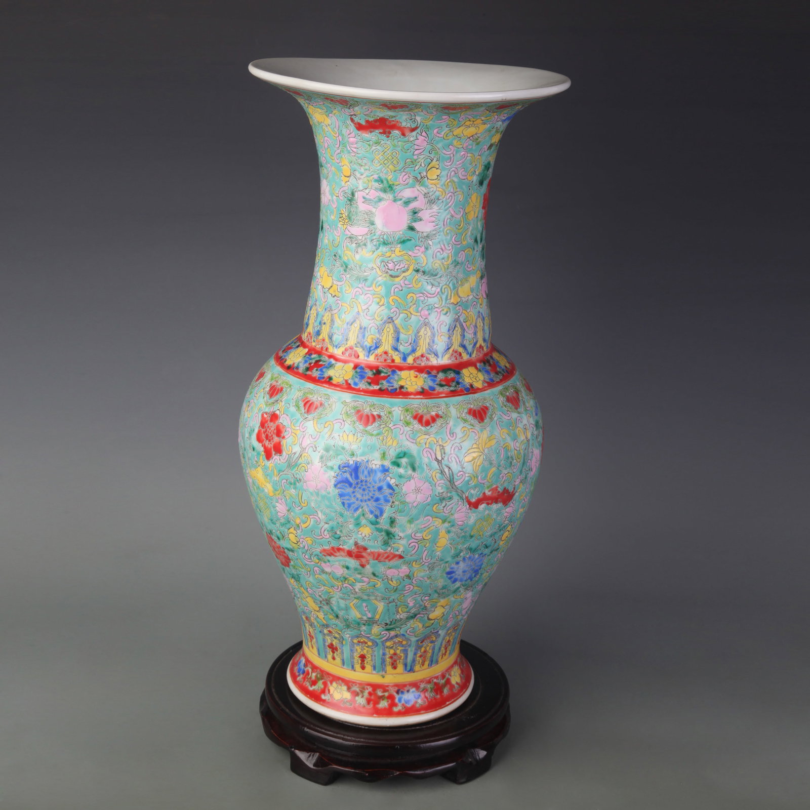 FAMILLE ROSE GREEN GROUND FLOWER PATTERN PORCELAIN VASE: Qing Dynasty Qian Long Period; High: 16.6 inch; Wooden base for picture and display only.