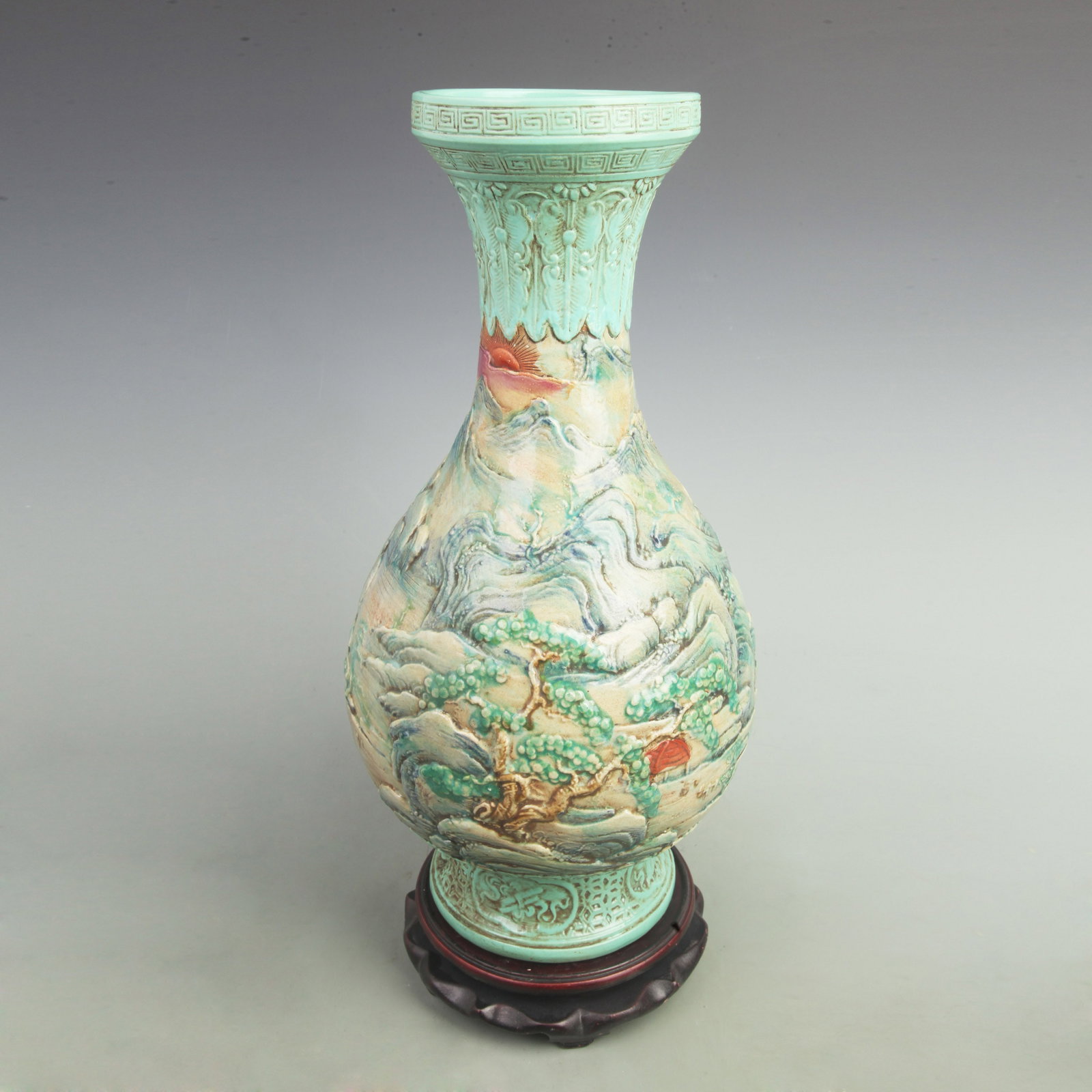 FINE FAMILLE ROSE CARVED LANDSCAPE PORCELAIN VASE: Qing Dynasty; H:17inch Width: 9.2inch; Wooden base for picture and display only.