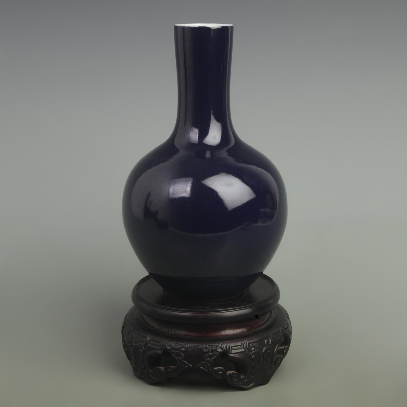 A DARK BLUE GLAZED CELESTIAL GLOBE PORCELAIN VASE: Qing Dynasty Qianlong Period; High: 8.5 inch; Width: 5.5 inch. Wooden base for picture and display only.