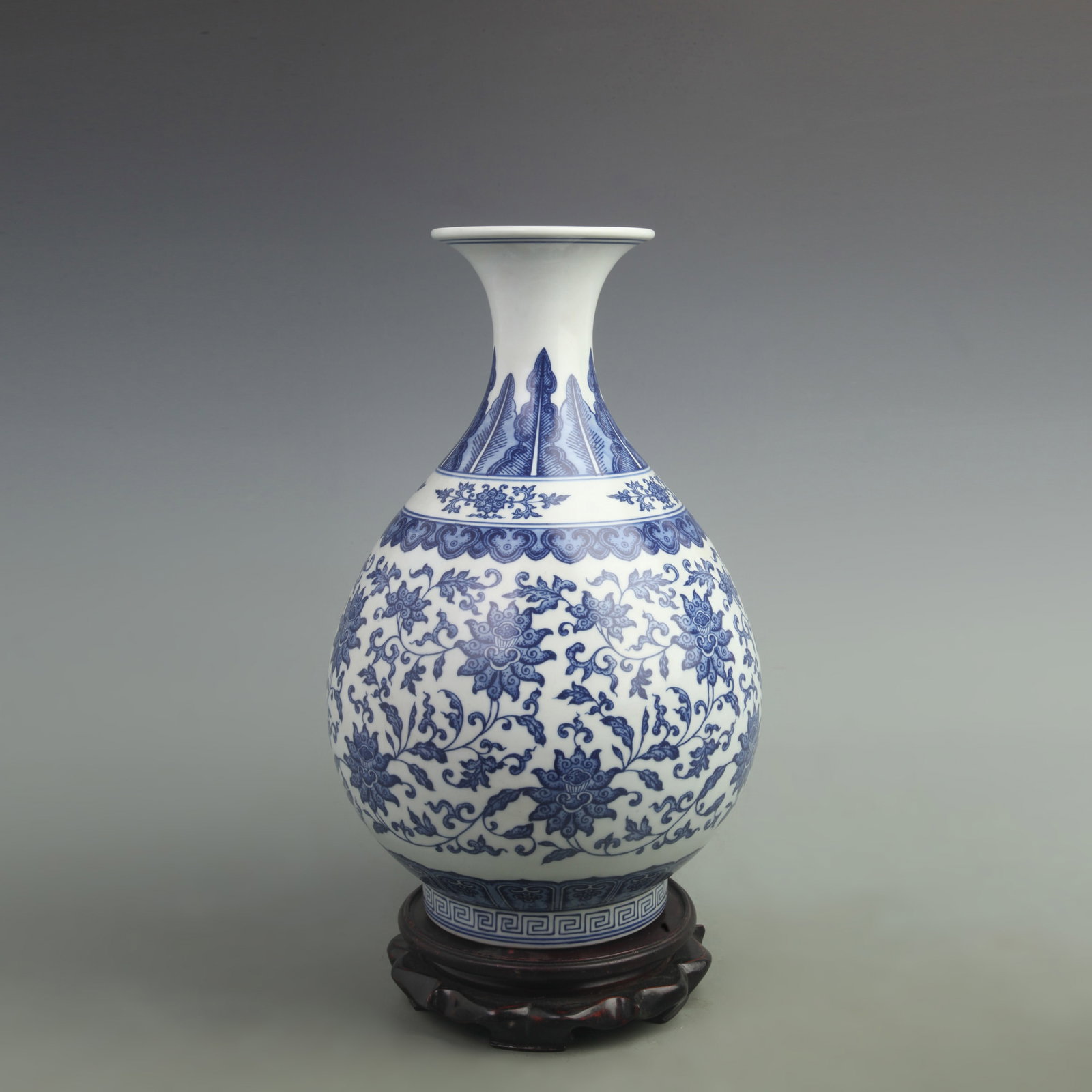 BLUE AND WHITE ENTWINED LOTUS YUHUCHUN STYLE PORCELAIN VASE: Qing Dynasty Qian Long Period; High: 15 inch; Width: 8 inch; Wooden base for picture and display only.