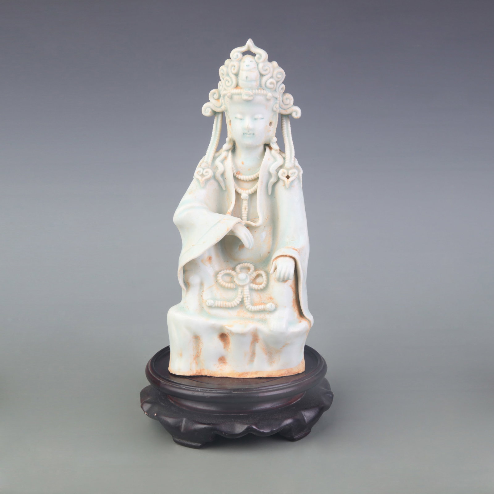A YINGQING GLAZED FIGURE OF GUANYIN: Tang Dynasty Style; Width: 3.6 inch; High: 8.3 inch; Wooden base for picture and display only.