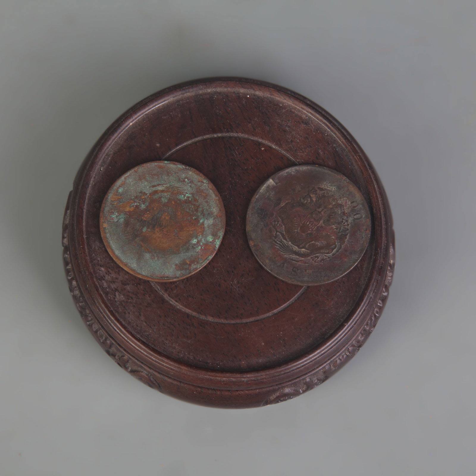 PAIR OF ‘GUANGXU YUANBAO’ COINS: Republic Period; Diameter: 1.3 inch; Wooden base for picture and display only.