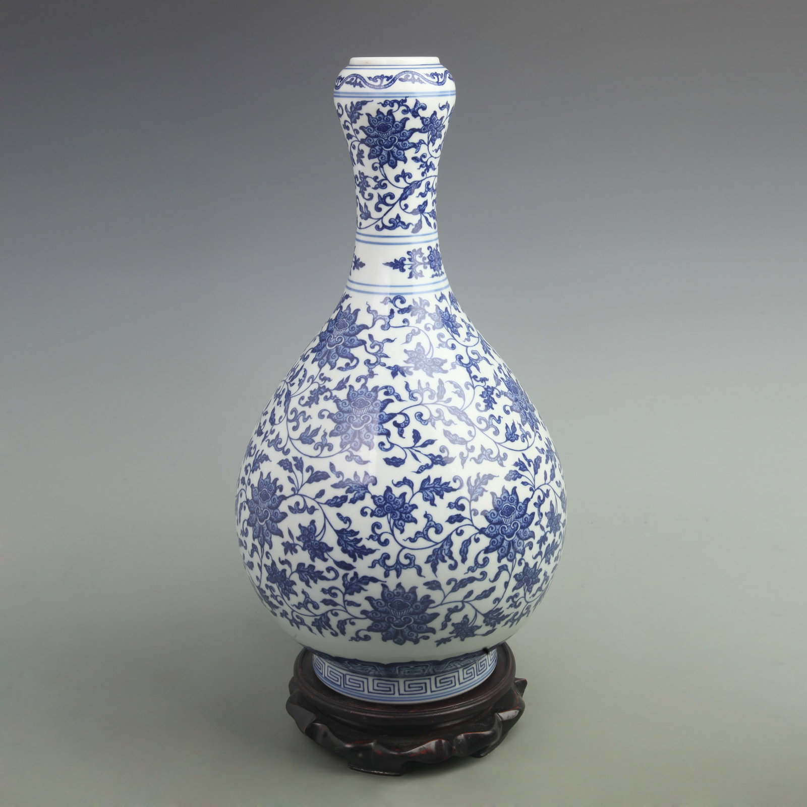 BLUE-AND-WHITE ENTWINED LOTUS GARLIC-HEAD PORCELAIN VASE: Qing Dynasty Qian Long Period, High: 16.3 inch; Width:8 inch; Wooden base for picture and display only.