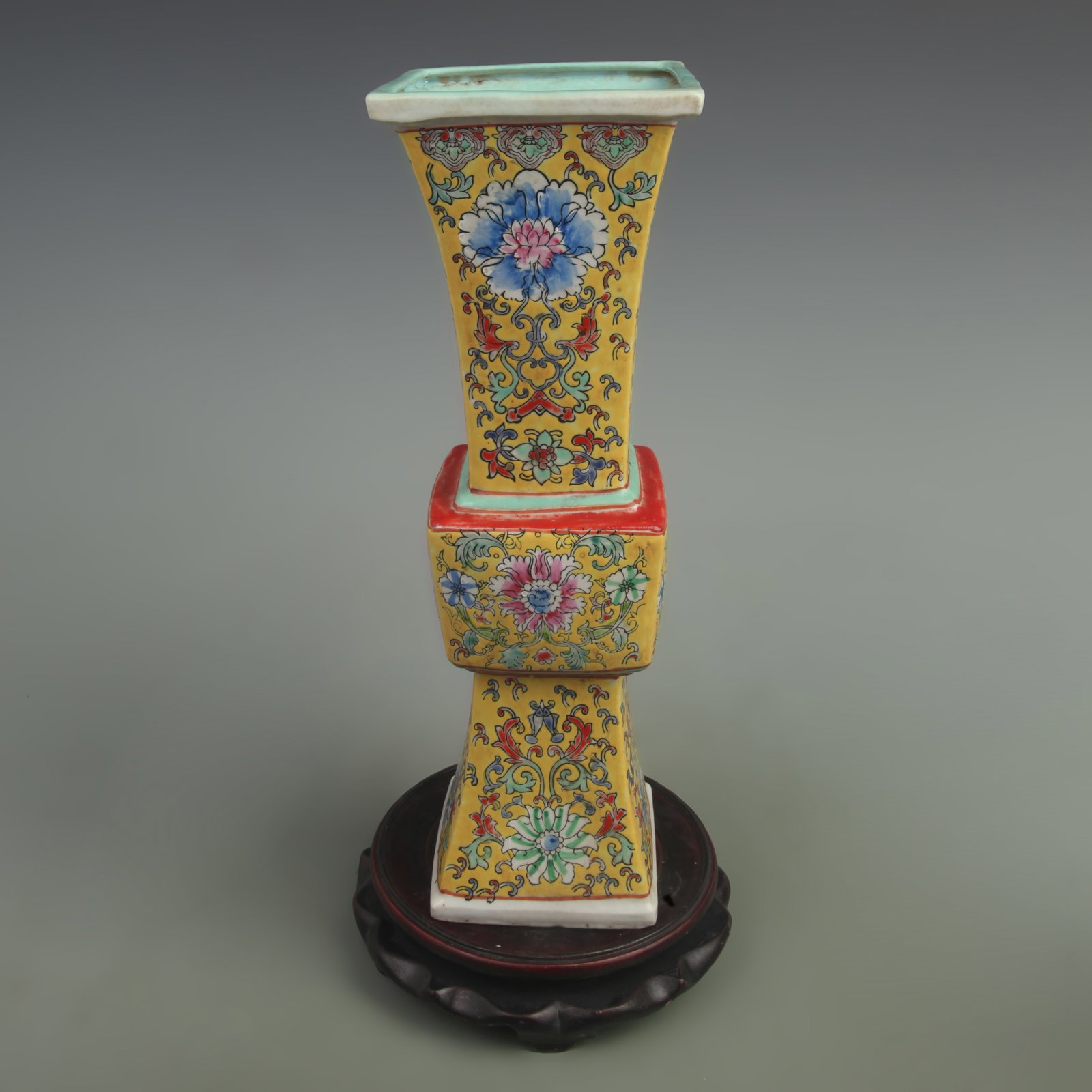 FAMILLE ROSE GREEN GROUND FLORAL PATTERN SQUARE FLOWER VASE: Qing Dynasty; Yong Zheng Period; High: 13.8 inch Diameter: 4.5 inch; Wooden base for picture and display only.