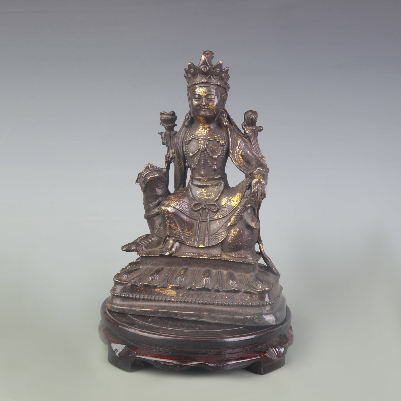 A FINE BRONZE STATUE OF MANJUSHRI WITH LION MOUNT: Qing Dynasty; High: 9.0 inch. Wooden base for picture and display only.
