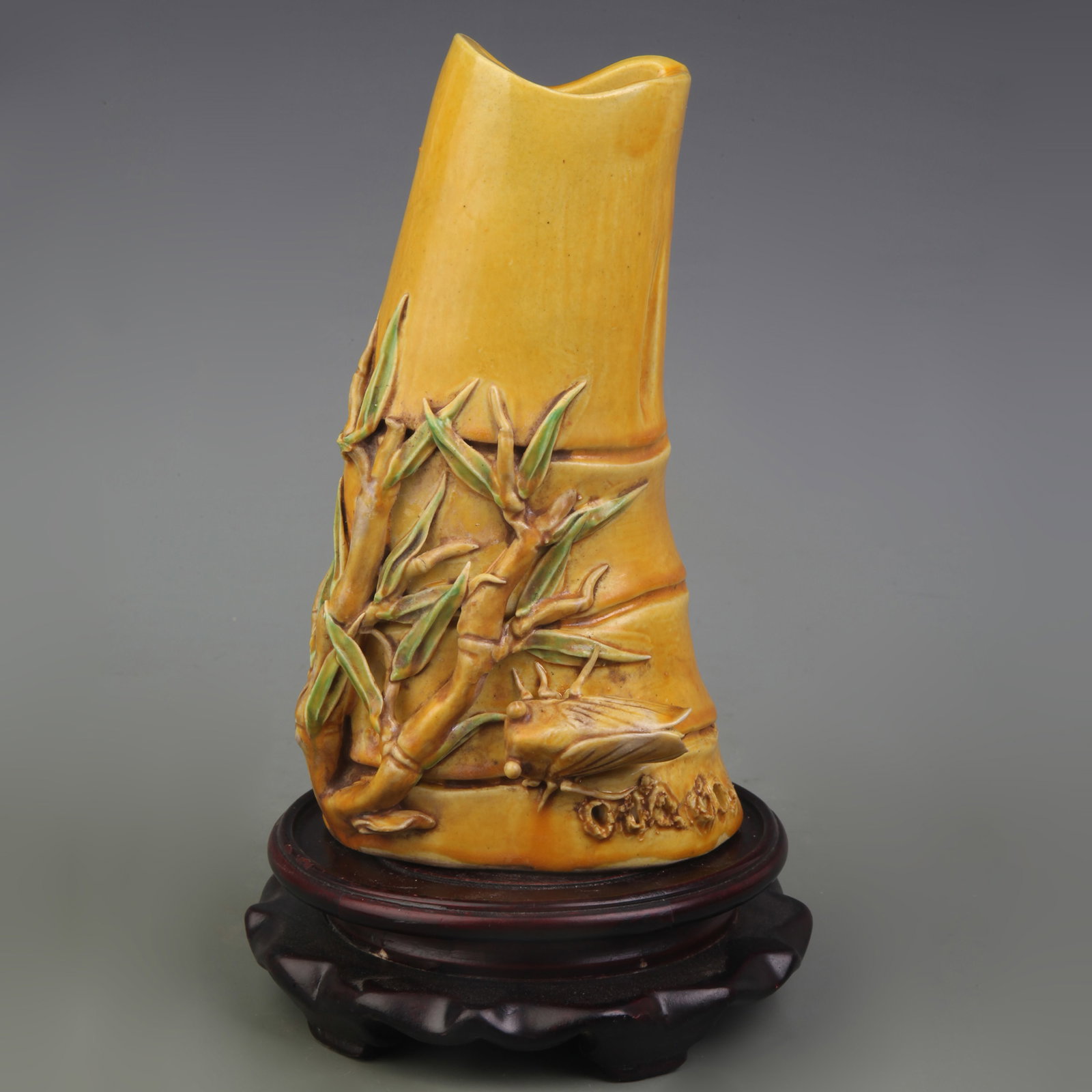A YELLOW-GLAZED HANGING VASE WITH FLORAL AND BIRD MOTIF: Qing Dynasty; Width: 3.8 inch; High: 7.2 inch; Wooden base for picture and display only.