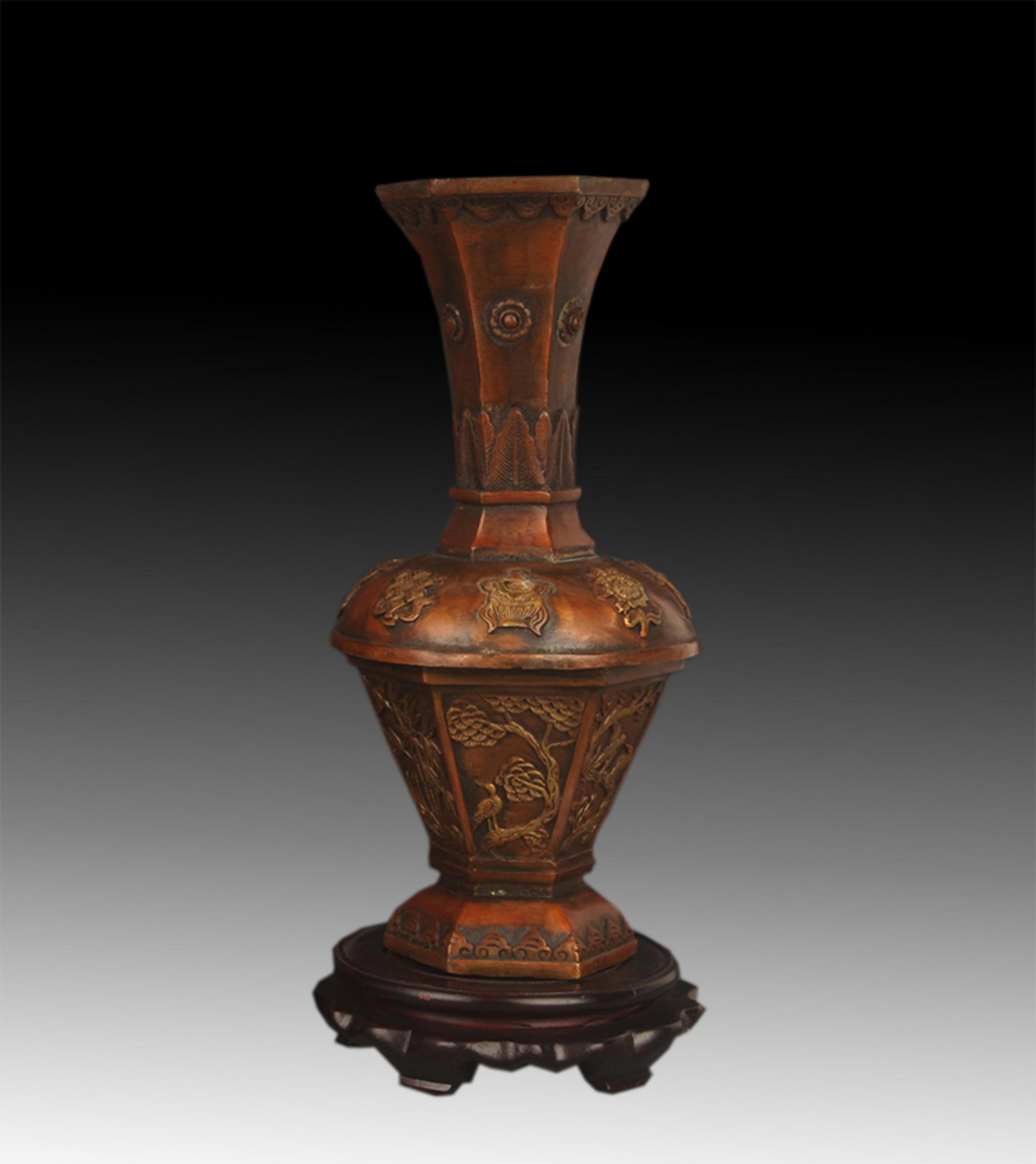 A FINE BRONZE HEXAGONAL VASES WITH AUSPICIOUS EIGHT TREASURES AND FLORAL PATTERNS: 20th Century; High: 11.25 inch; Diameter: 3.75 inch. Wooden base for picture and display only.