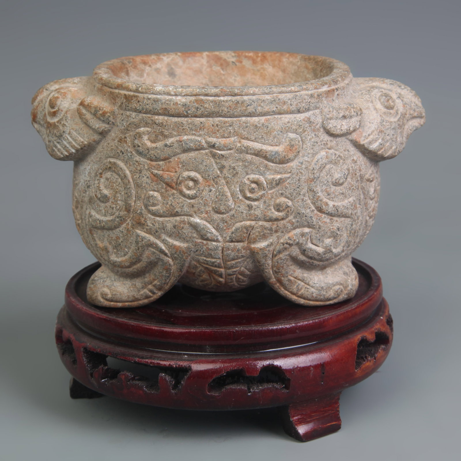 A FOUR-LEGGED BEAST-HANDLED STONE INCENSE BURNER: Zhou Dynasty Style; Long: 5.5 inch; Width: 3.5 inch; High: 3.2 inch; Wooden base for picture and display only.