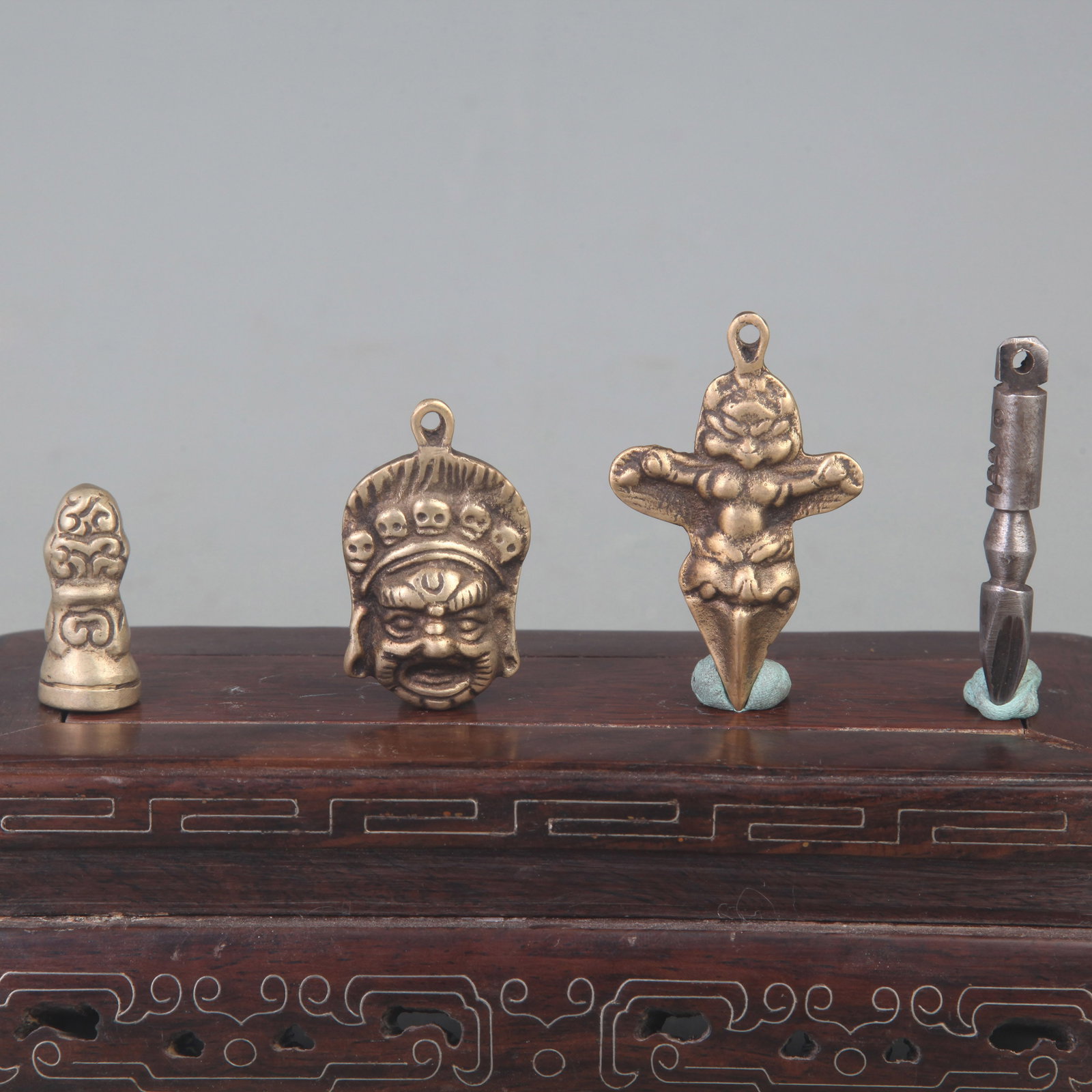 TIBETAN BUDDHIST STATUES AND RITUAL IMPLEMENTS: Qing Dynasty; Long: 2.2 inch; to 1.3 inch. Wooden base for picture and display only.