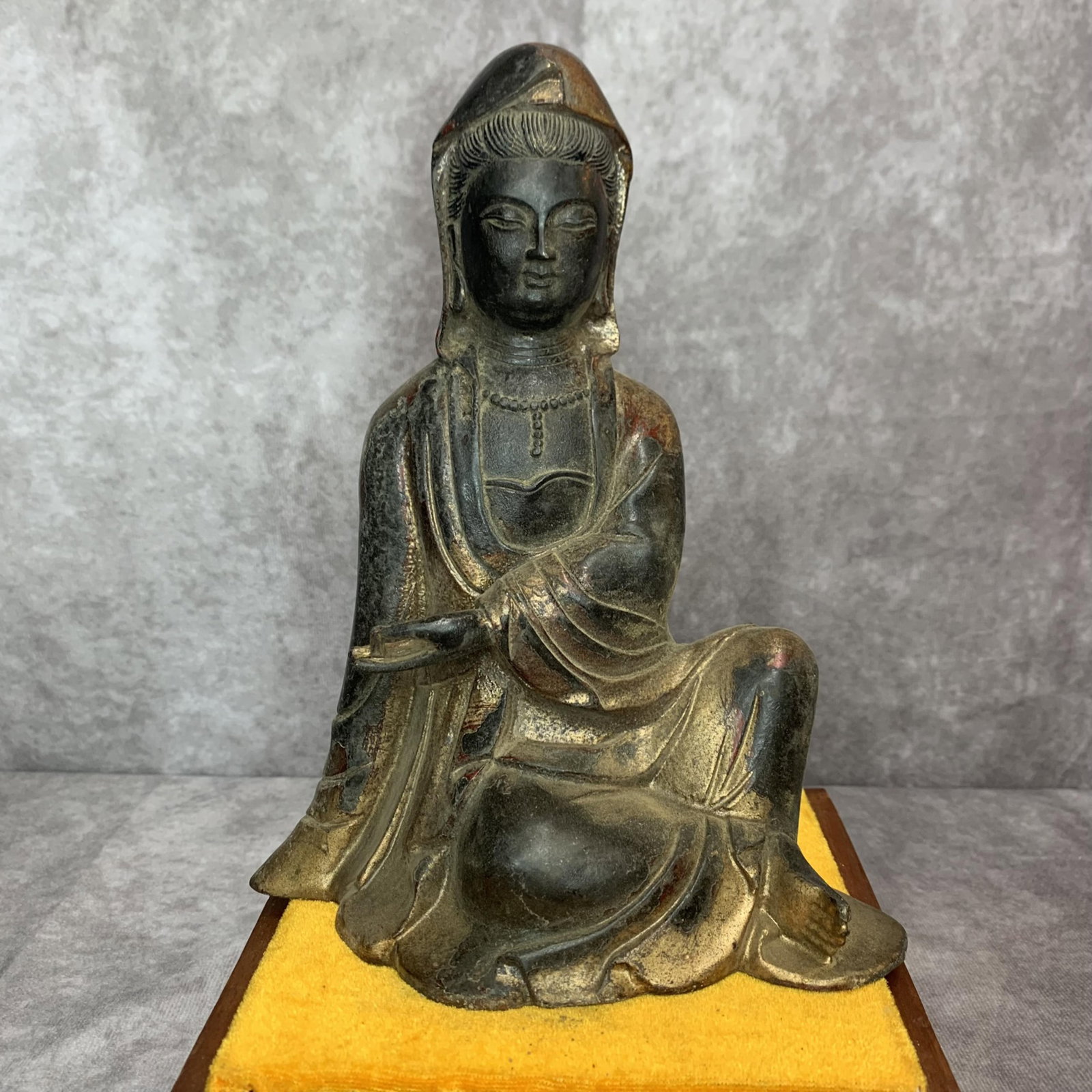 A FINE BRONZE SEATED FIGURE OF GUANYIN: Qing Dynasty; High: 8.3 inch; Width: 6.5 inch; Long: 3.8 inch; Wooden base for picture and display only.