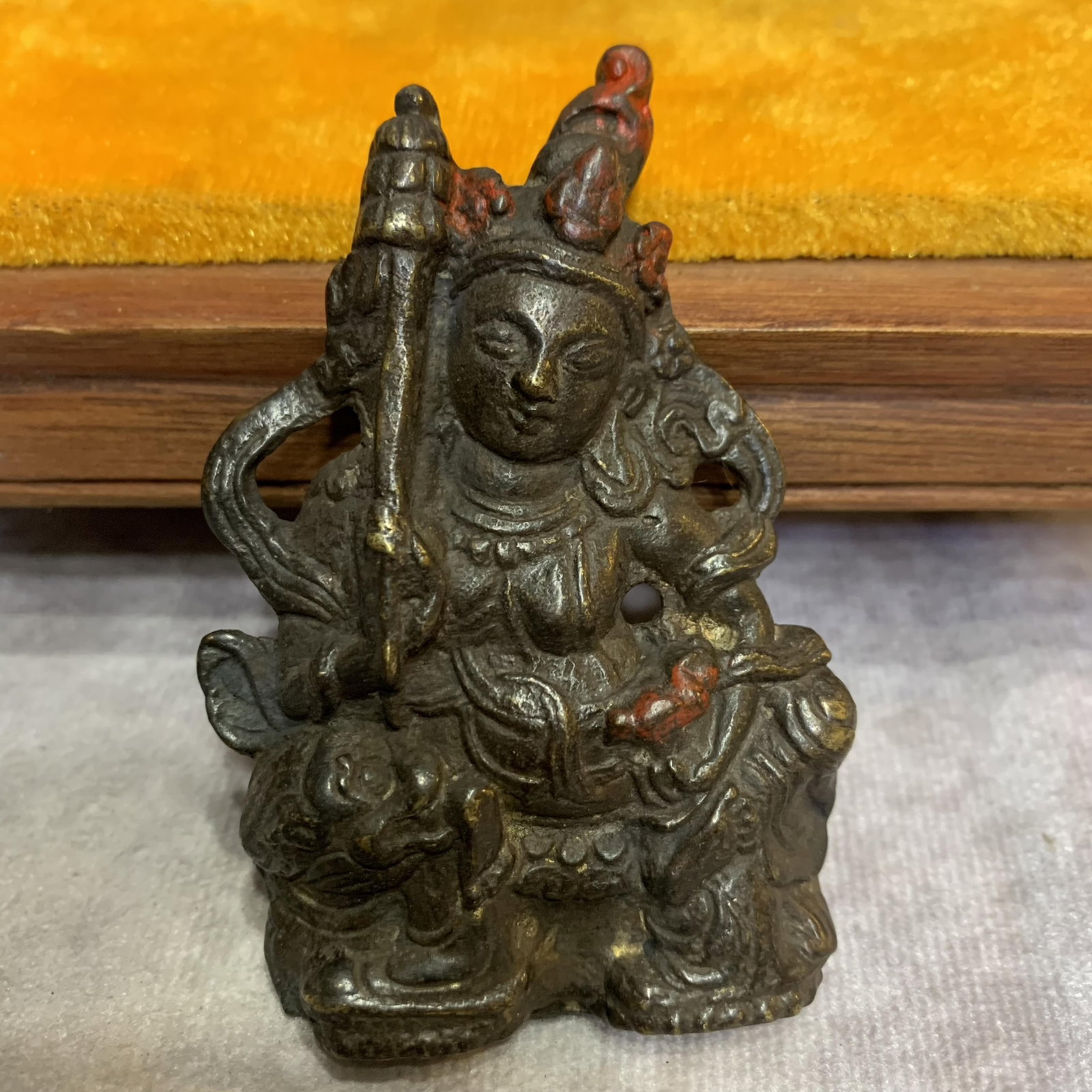 A FINE SMALL BRONZE BUDDHA PENDANT: Qing Dynasty; High: 3.0 inch; Width: 2.0 inch; Wooden base for picture and display only.