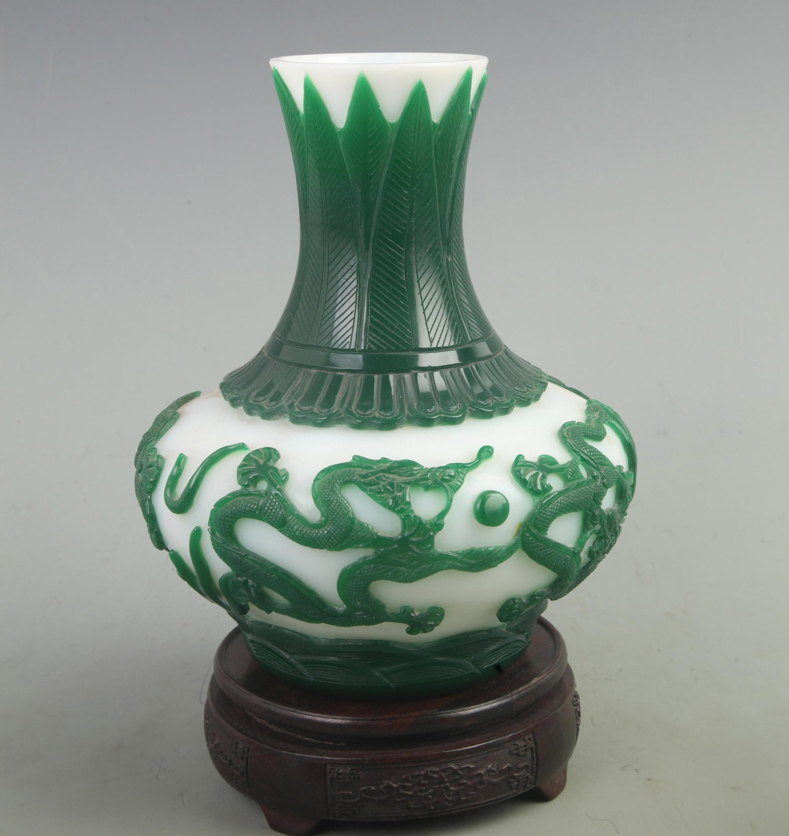 A RARE GLASS MADE FINELY CARVED VASE: 19th Century, High: 8.5 inch; Diameter:4 inch. Wooden base for picture and display only.