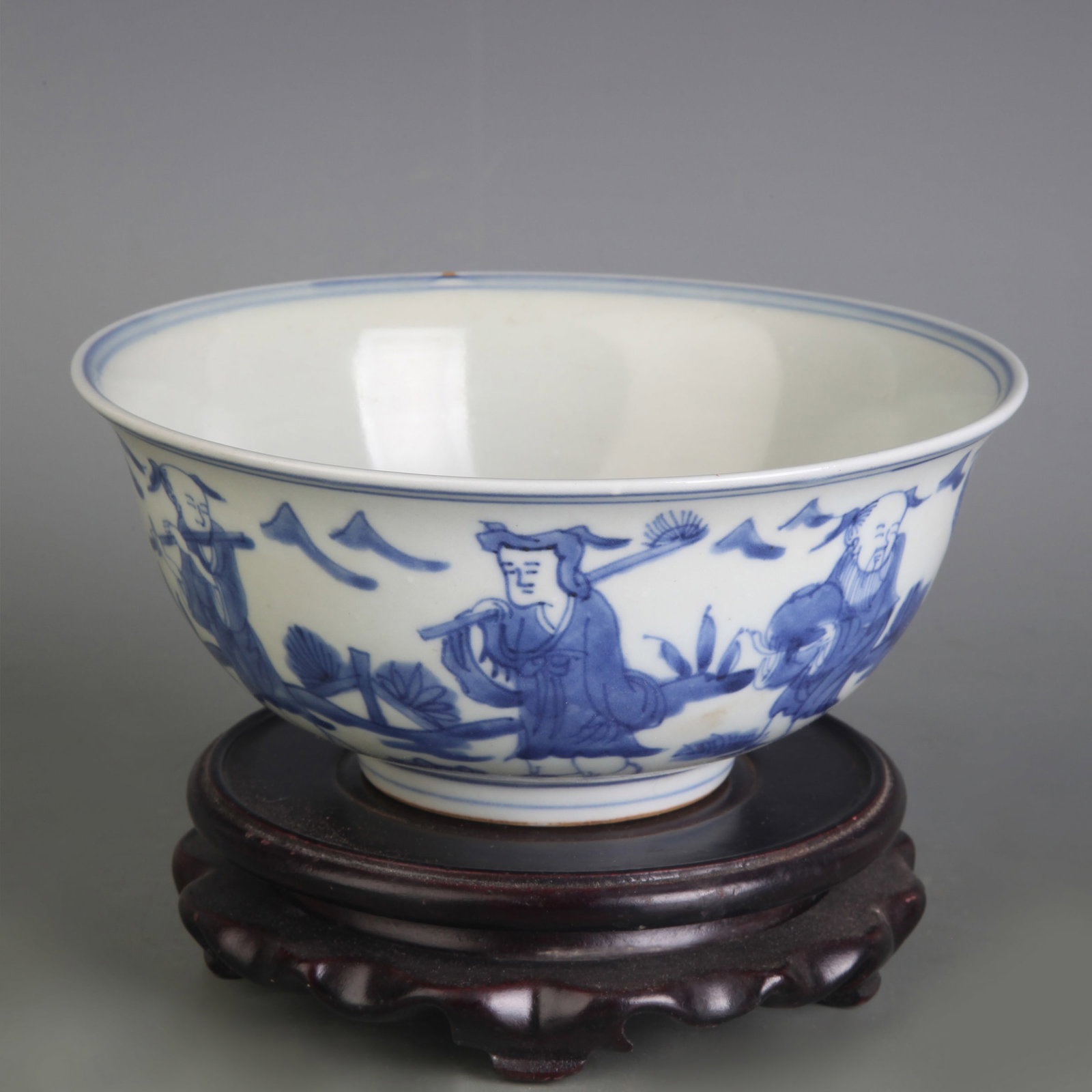 A BLUE AND WHITE BOWL WITH FIGURAL DECORATION: Qing Dynasty; Diameter: 6.4 inch; High: 2.8 inch; Wooden base for picture and display only.