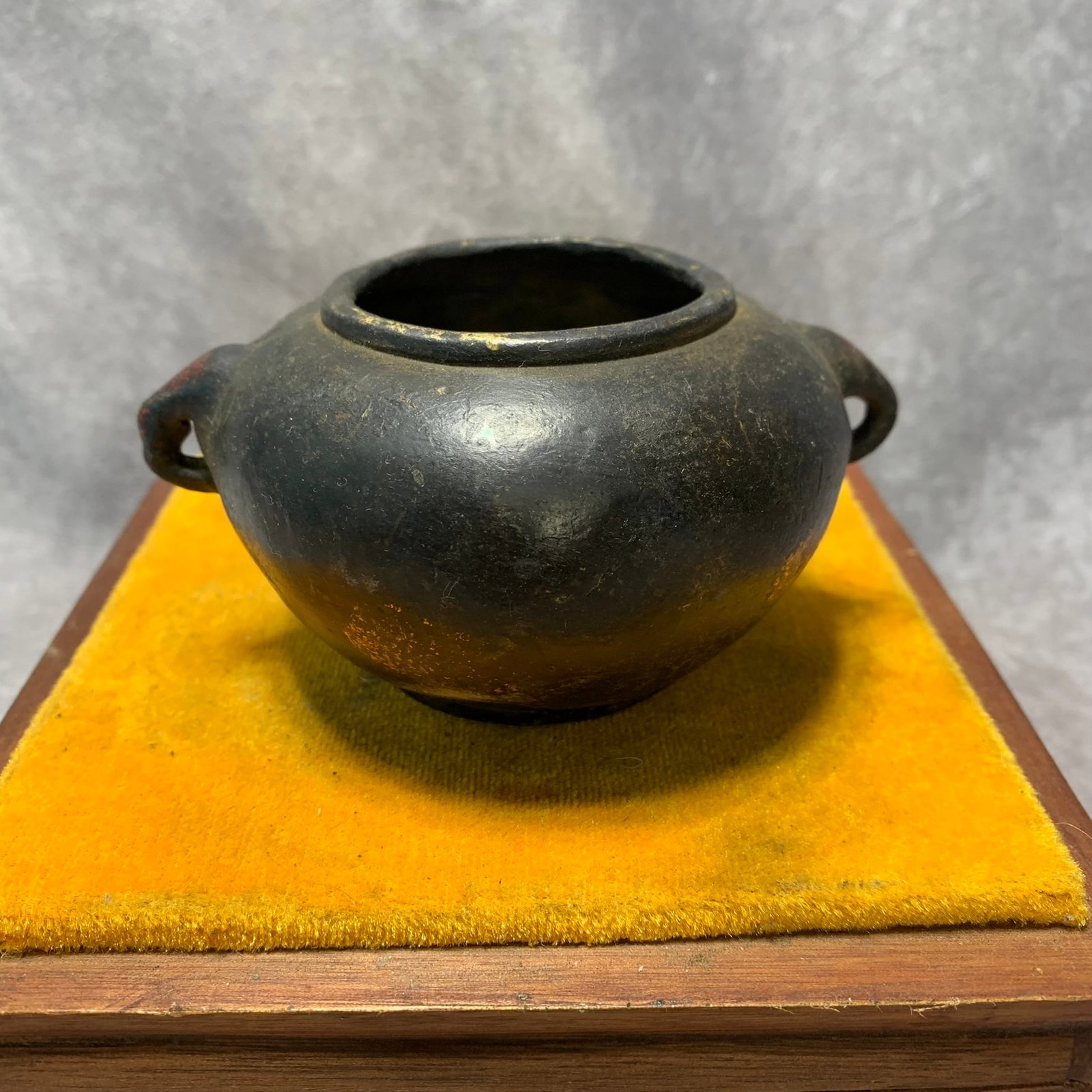 A XUANDE MARKED GILT-BRONZE CENSER WITH ANIMAL-HEAD HANDLES: Ming Dynasty Style; H; 2.5 inch; Diameter: 4.5 inch; Wooden base for picture and display only.