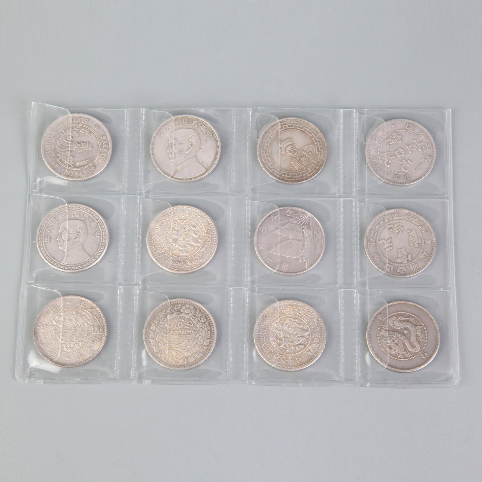 A GROUP OF TWELVE VINTAGE CHINESE COINS: Republic Period; Diameter: 1.0 inch