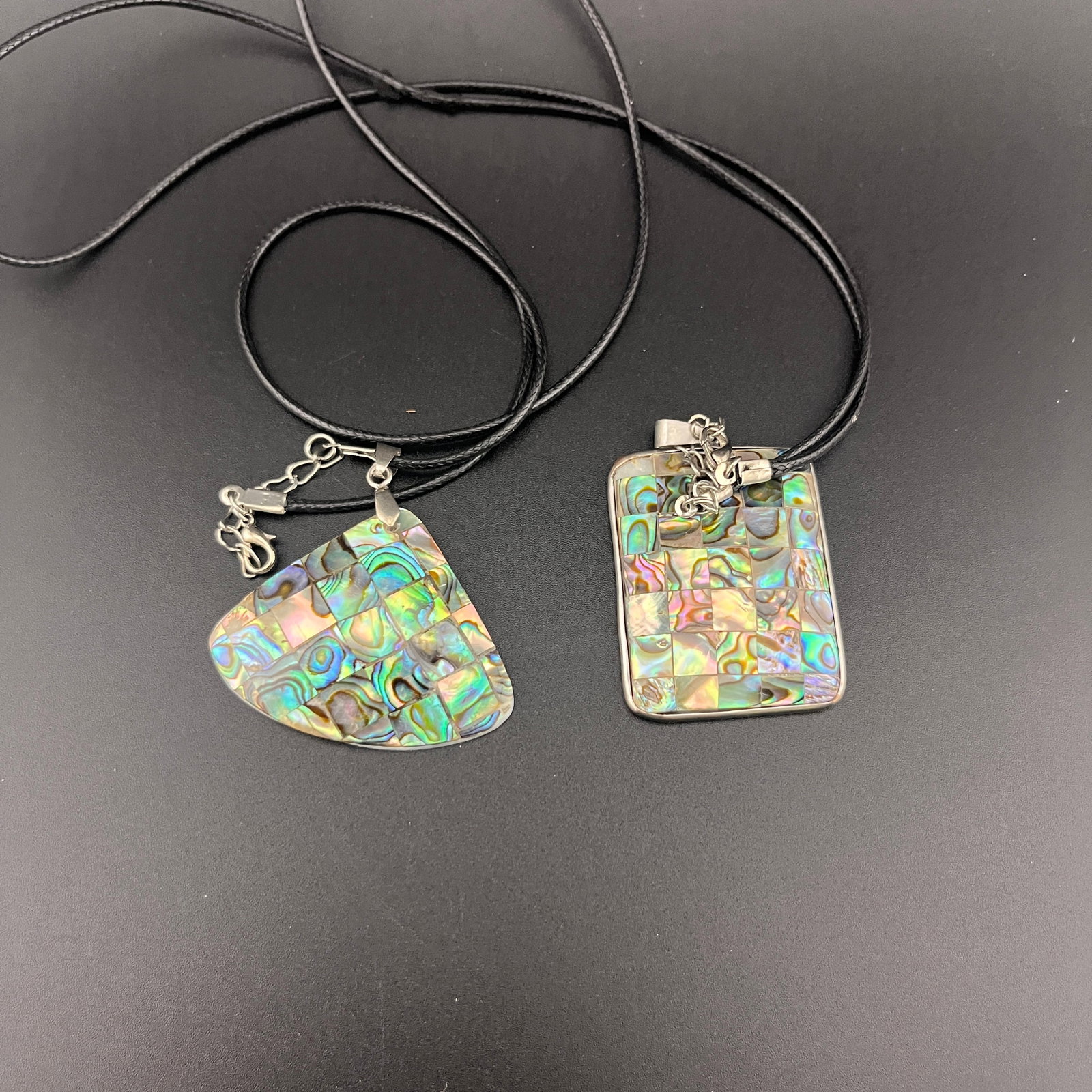 GROUP OF TWO ABALON SHELL MADE MODERN NECKLACE: Modern; Long: 1.8 inch; Width: 1.25 inch; High: 0.2 inch; Long: 1.42 inch; Width: 1.45 inch; High: 0.2 inch.